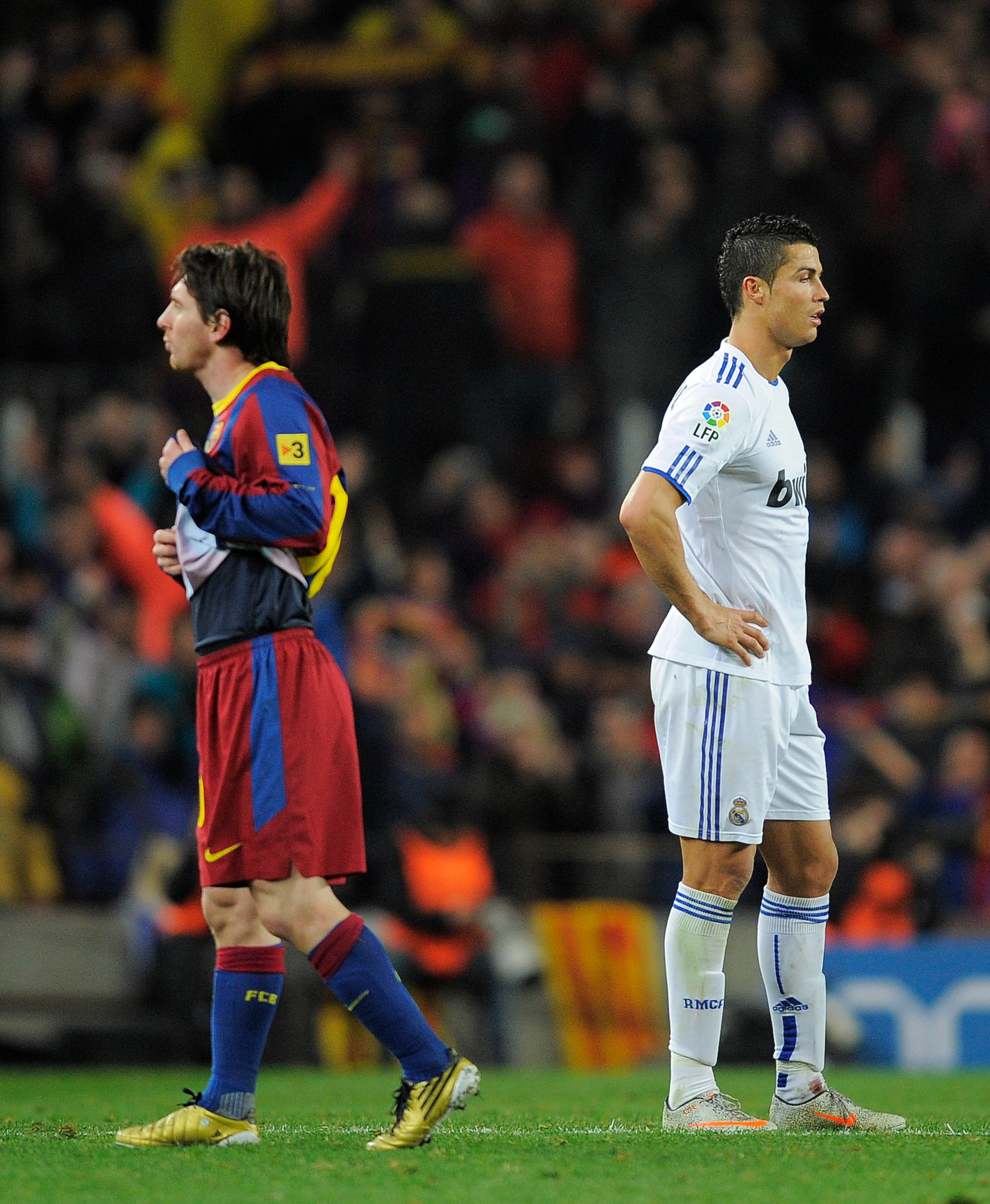 BARCELONA, SPAIN - NOVEMBER 29:  Cristiano Ronaldo of Real Madrid (R) and Lionel Messi of FC Barcelona look on during the La Liga match between Barcelona and Real Madrid at the Camp Nou Stadium on November 29, 2010 in Barcelona, Spain.  Barcelona won the