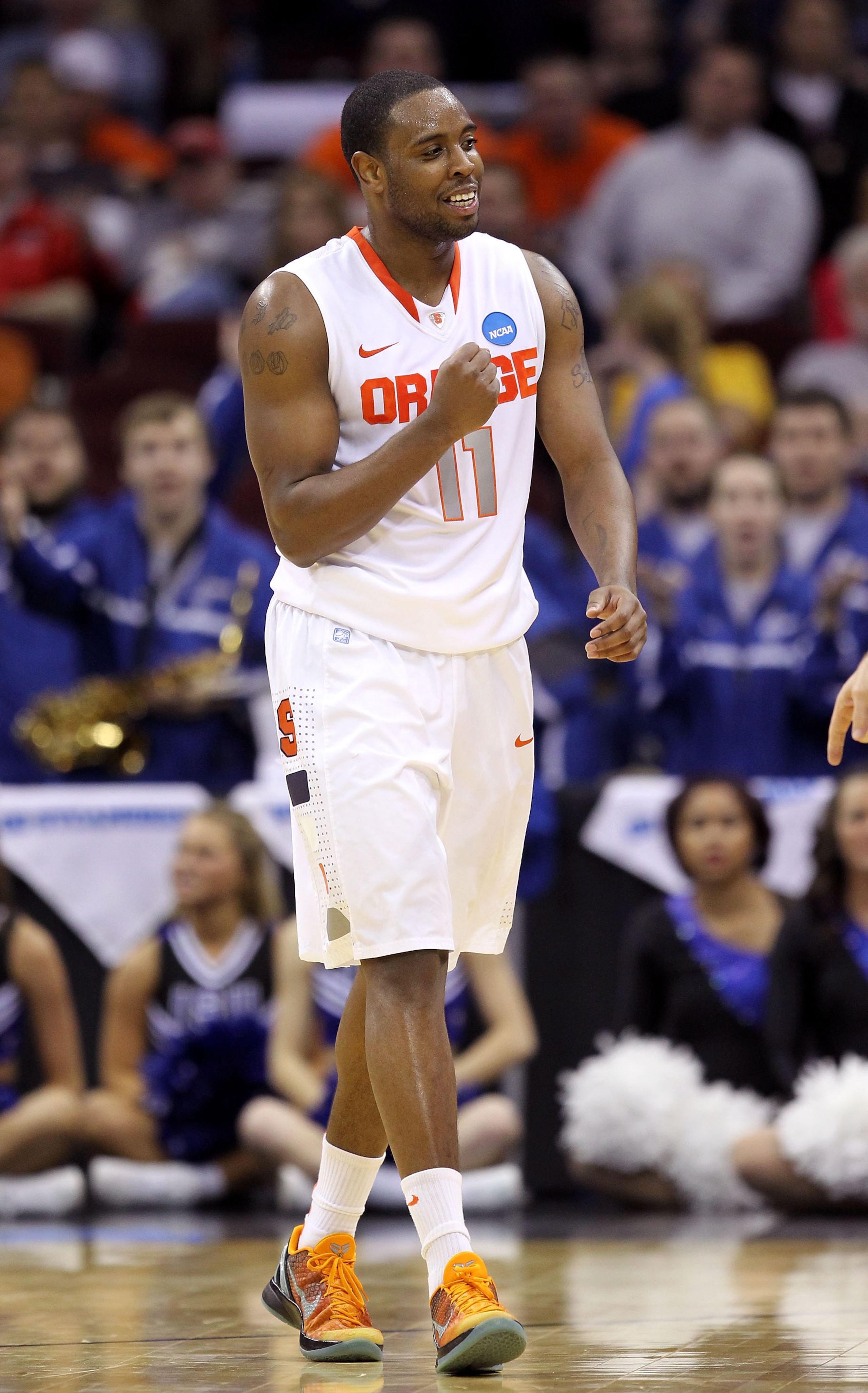 CLEVELAND, OH - MARCH 18: Scoop Jardine #11 of the Syracuse Orange pumps his fist during the second half against the Indiana State Sycamores during the second round of the 2011 NCAA men's basketball tournament at Quicken Loans Arena on March 18, 2011 in C