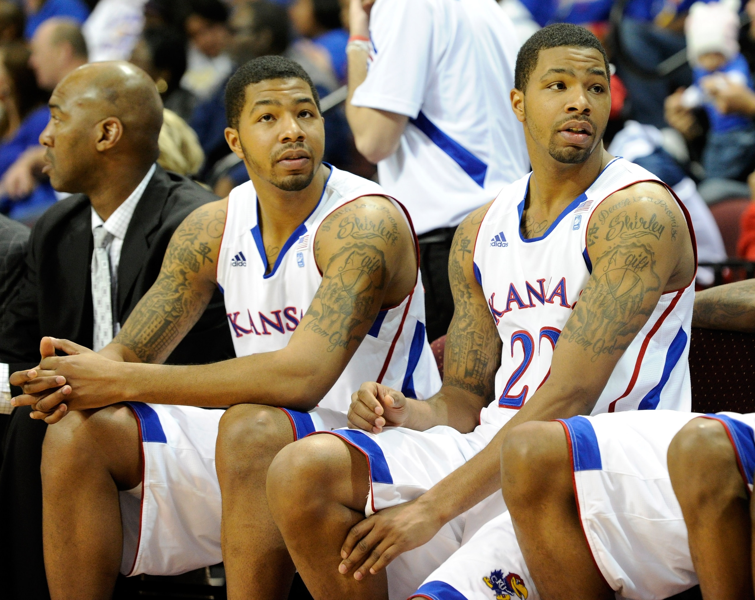 LAS VEGAS - NOVEMBER 26:  Markieff Morris (L) #21 and his twin brother Marcus Morris #22 of the Kansas Jayhawks appear on the bench late in the team's 98-41 victory over the Ohio Bobcats during the third round of the Las Vegas Invitational at The Orleans