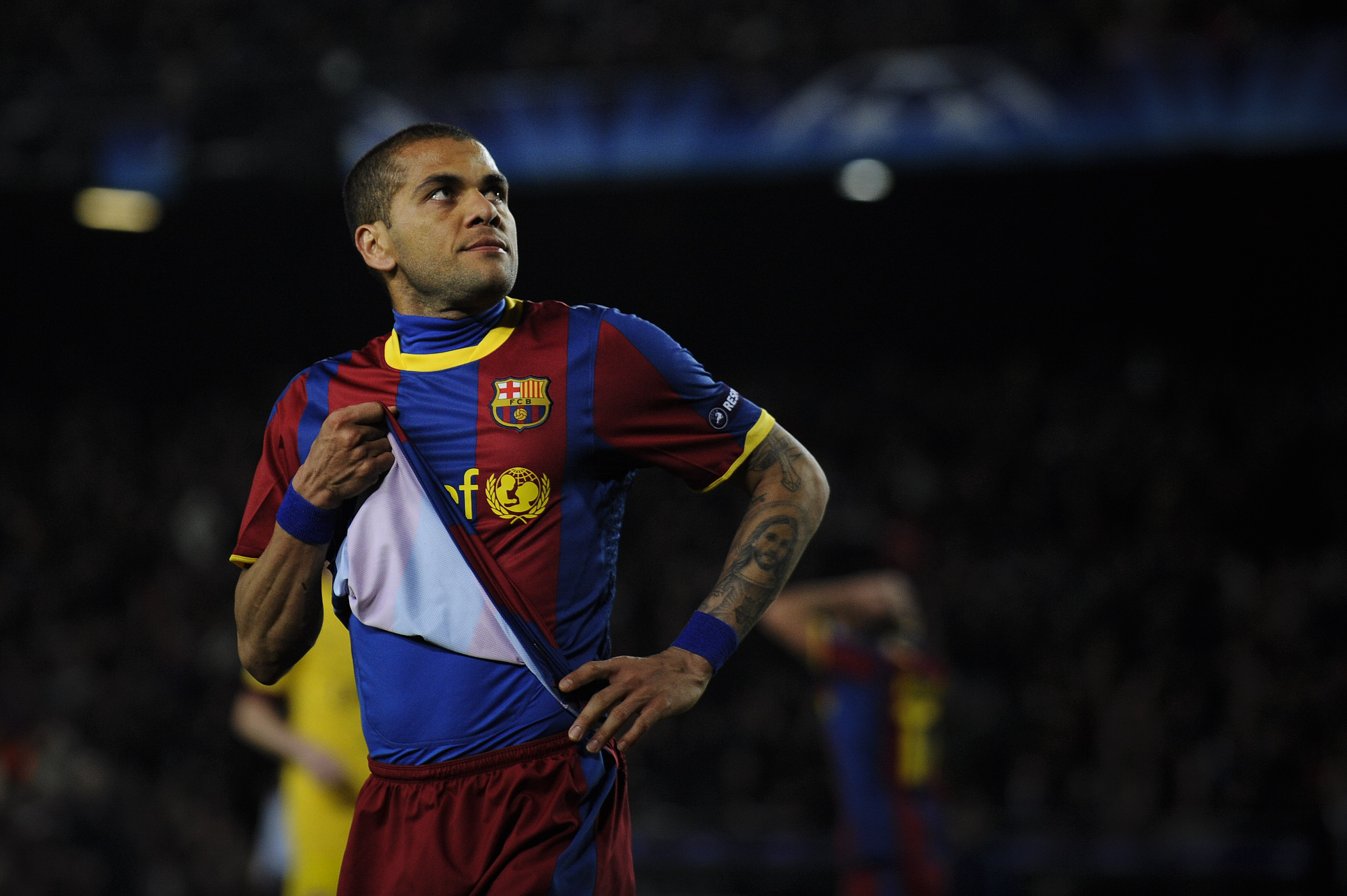 BARCELONA, SPAIN - MARCH 08:  Dani Alves of FC Barcelona looks on during the UEFA Champions League round of 16 second leg match between Barcelona and Arsenal at the Camp Nou stadium on March 8, 2011 in Barcelona, Spain.  (Photo by David Ramos/Getty Images