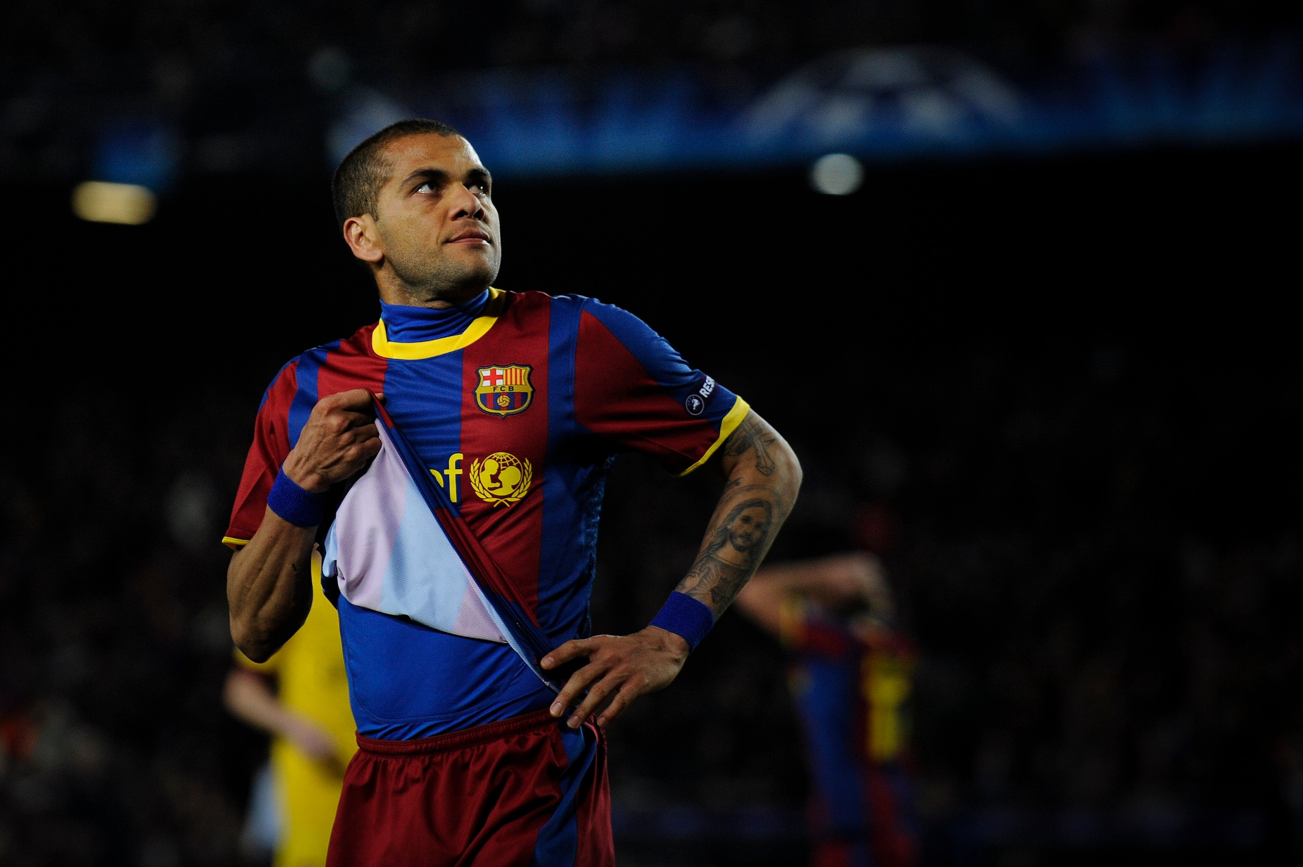 BARCELONA, SPAIN - MARCH 08:  Dani Alves of FC Barcelona looks on during the UEFA Champions League round of 16 second leg match between Barcelona and Arsenal at the Camp Nou stadium on March 8, 2011 in Barcelona, Spain.  (Photo by David Ramos/Getty Images