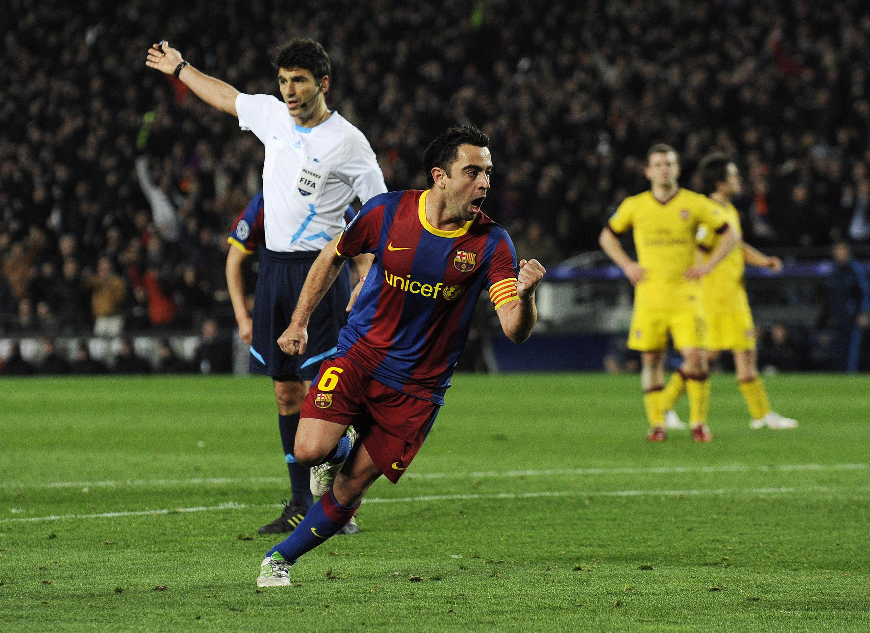BARCELONA, SPAIN - MARCH 08:  Xavi Hernandez of FC Barcelona (C) celebrates after scoring his team's second goal during the UEFA Champions League round of 16 second leg match between Barcelona and Arsenal at the Camp Nou stadium on March 8, 2011 in Barcel