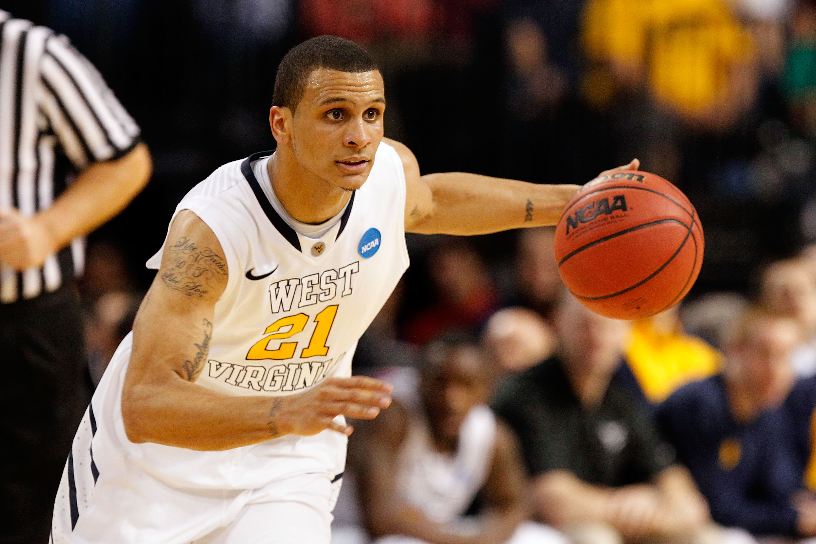 TAMPA, FL - MARCH 17: Joe Mazzulla #21 of the West Virginia Mountaineers drives against the Clemson Tigers during the second round of the 2011 NCAA men's basketball tournament at St. Pete Times Forum on March 17, 2011 in Tampa, Florida. (Photo by J. Mer