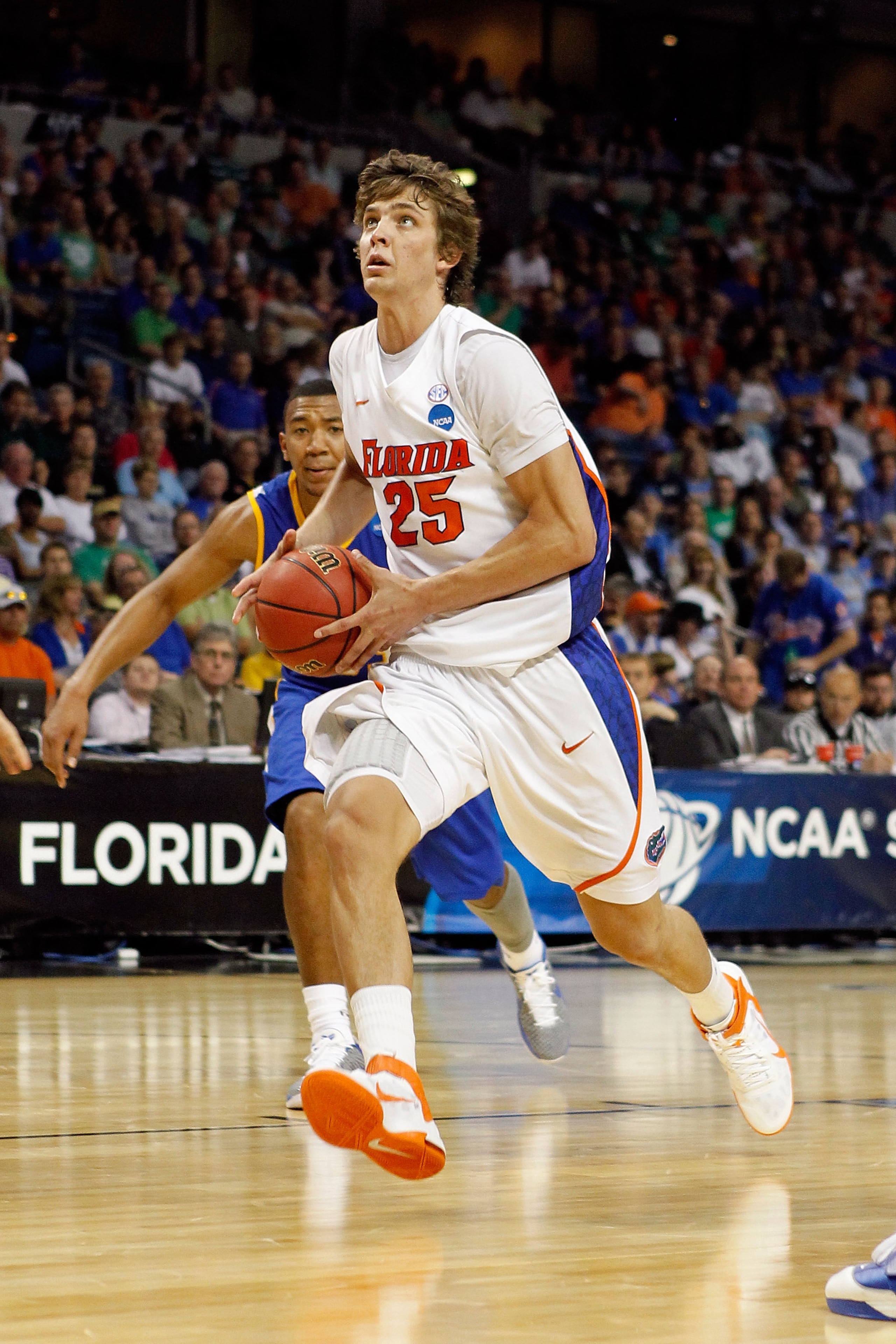 TAMPA, FL - MARCH 17: Chandler Parsons #25 of the Florida Gators drives against the UC Santa Barbara Gauchos during the second round of the 2011 NCAA men's basketball tournament at St. Pete Times Forum on March 17, 2011 in Tampa, Florida. Florida won 79- TAMPA, FL - MARCH 17: Chandler Parsons #25 of the Florida Gators drives against the UC Santa Barbara Gauchos during the second round of the 2011 NCAA men's basketball tournament at St. Pete Times Forum on March 17, 2011 in Tampa, Florida. Florida won 79-