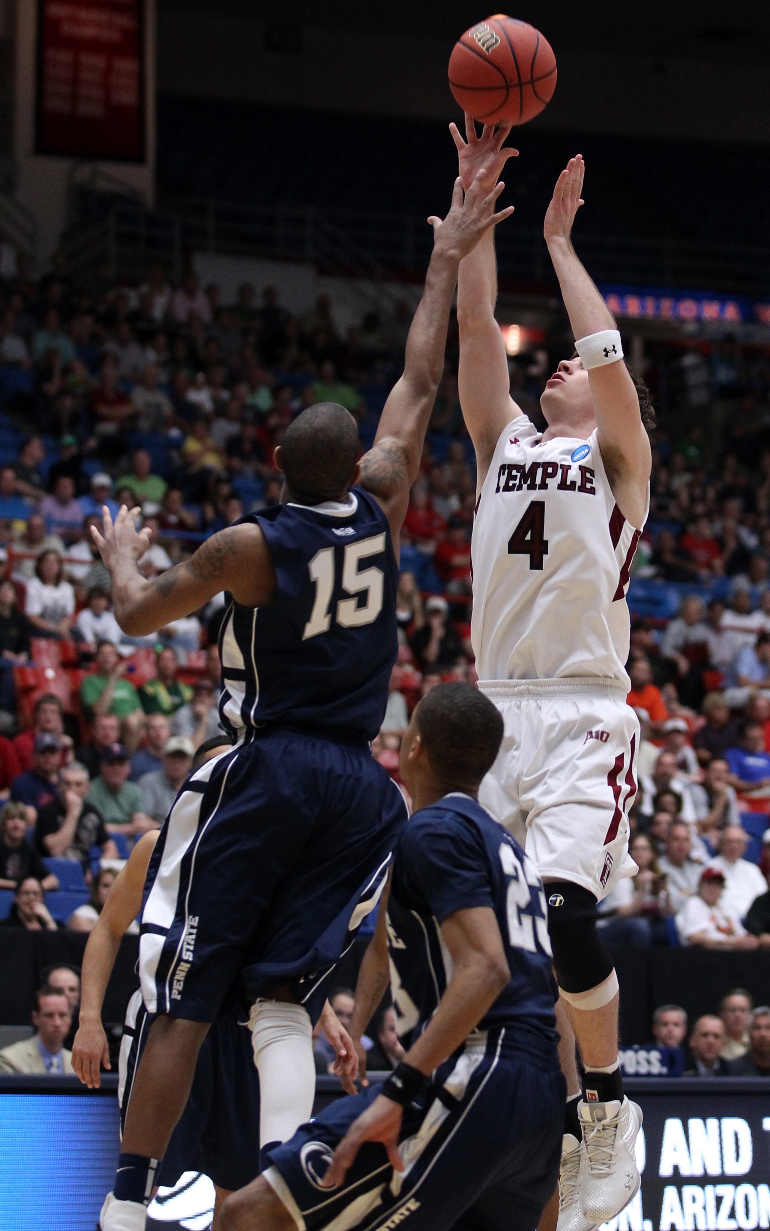 TUCSON, AZ - MARCH 17: Juan Fernandez #4 of the Temple Owls shoots over David Jackson #15 of the Penn State Nittany Lions during the second round of the 2011 NCAA men's basketball tournament at McKale Center on March 17, 2011 in Tucson, Arizona. (Photo TUCSON, AZ - MARCH 17: Juan Fernandez #4 of the Temple Owls shoots over David Jackson #15 of the Penn State Nittany Lions during the second round of the 2011 NCAA men's basketball tournament at McKale Center on March 17, 2011 in Tucson, Arizona. (Photo