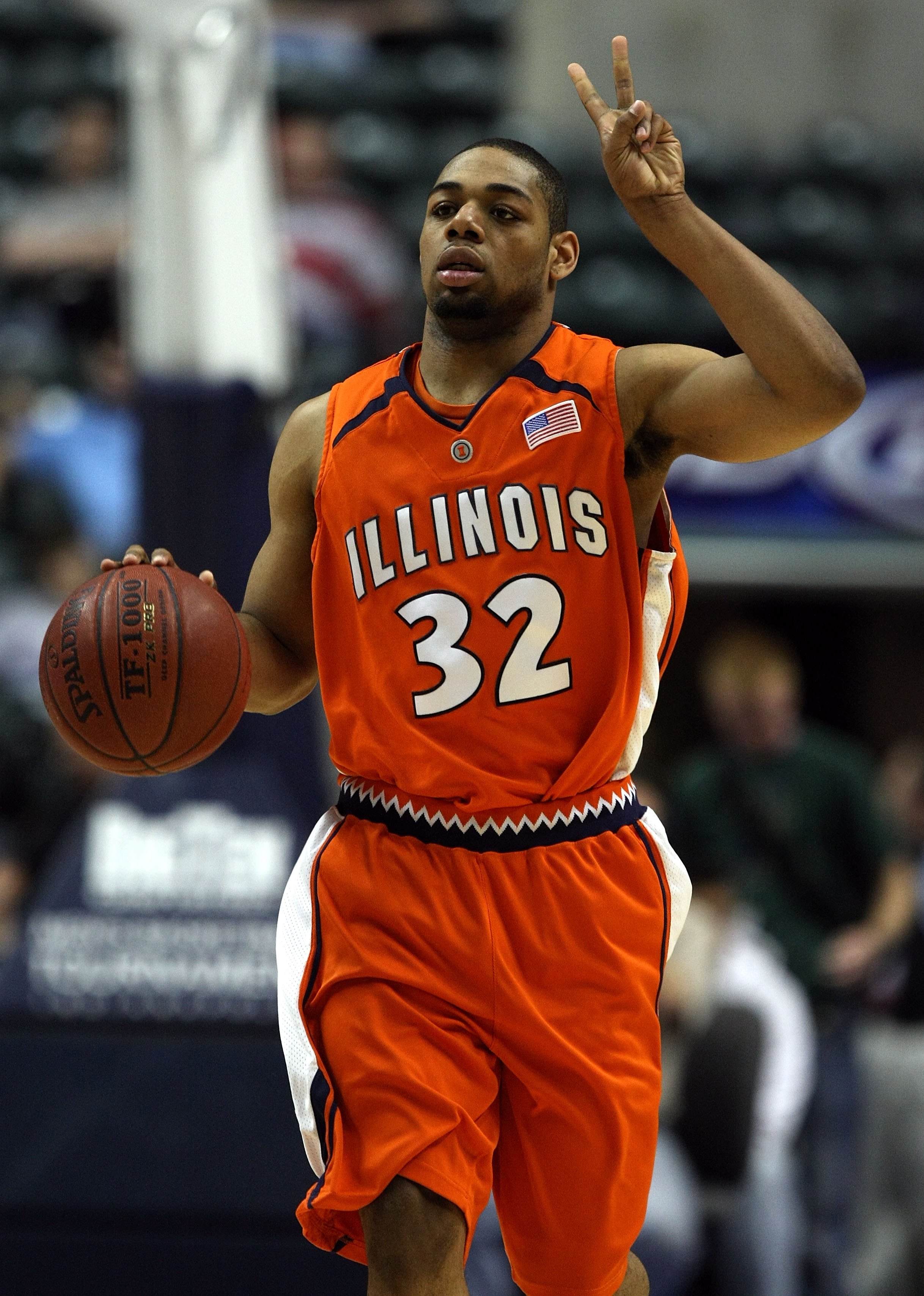 INDIANAPOLIS - MARCH 13: Demetri McCarney #32 of the Illinois Fighting Illini calls a play as he brings the ball up court against the Penn State Nittany Lions during the Big Ten Men's Basketball Tournament at Conseco Fieldhouse on March 13, 2008 in India