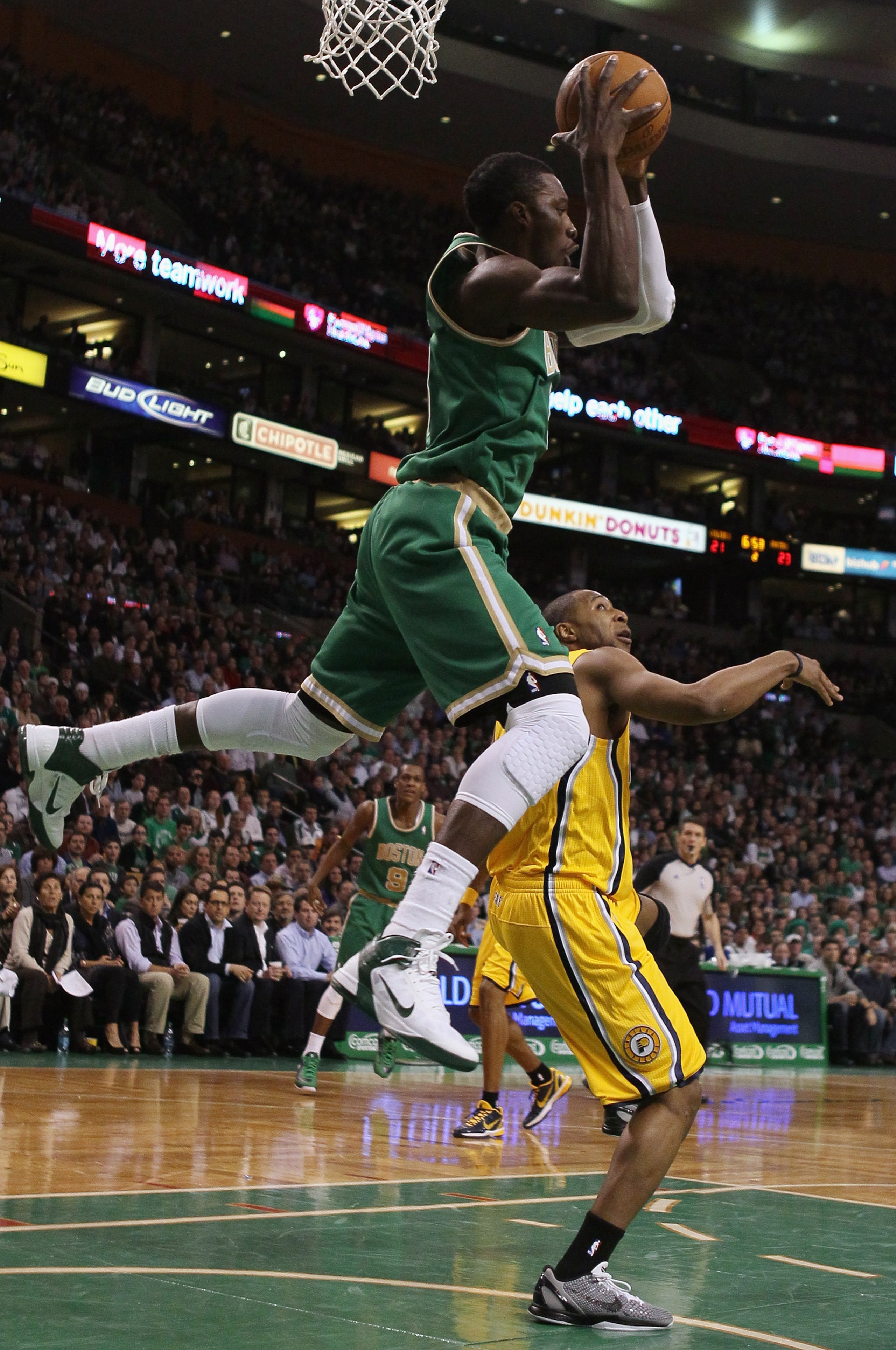 BOSTON, MA - MARCH 16:  Jeff Green #8 of the Boston Celtics grabs a pass as A.J. Price #12 of the Indiana Pacers defends on March 16, 2011 at the TD Garden in Boston, Massachusetts.  NOTE TO USER: User expressly acknowledges and agrees that, by downloadin
