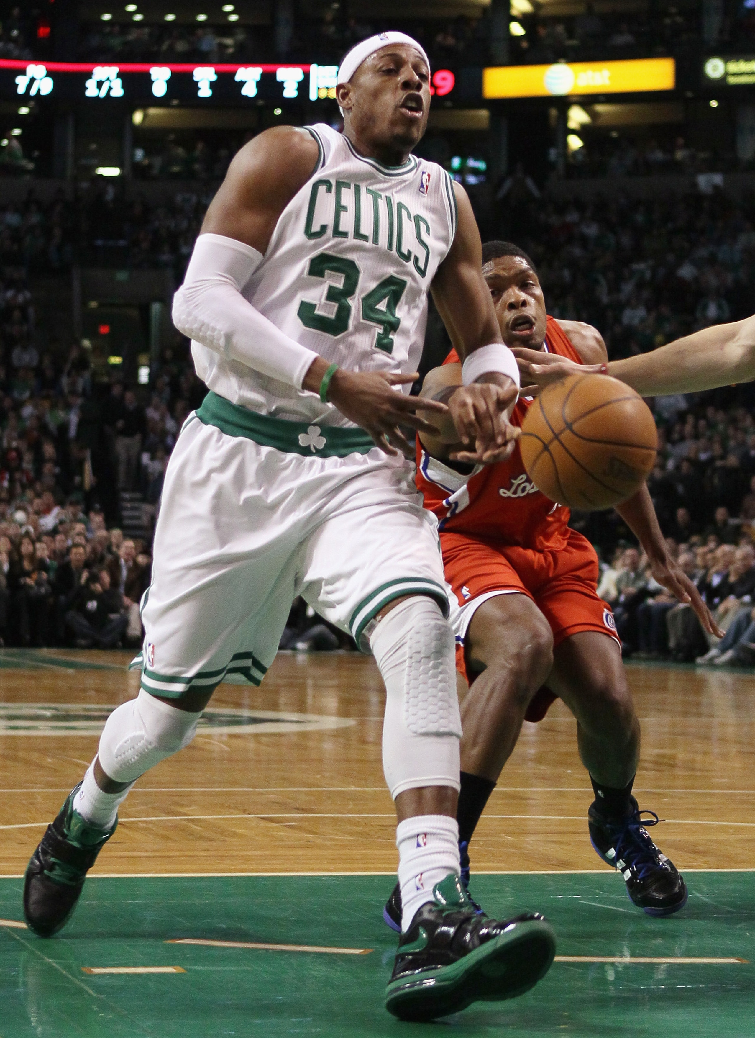 BOSTON, MA - MARCH 09:  Paul Pierce #34 of the Boston Celtics has the ball knocked away by Ryan Gomes #15 of the Los Angeles Clippers on March 9, 2011 at the TD Garden in Boston, Massachusetts. NOTE TO USER: User expressly acknowledges and agrees that, by