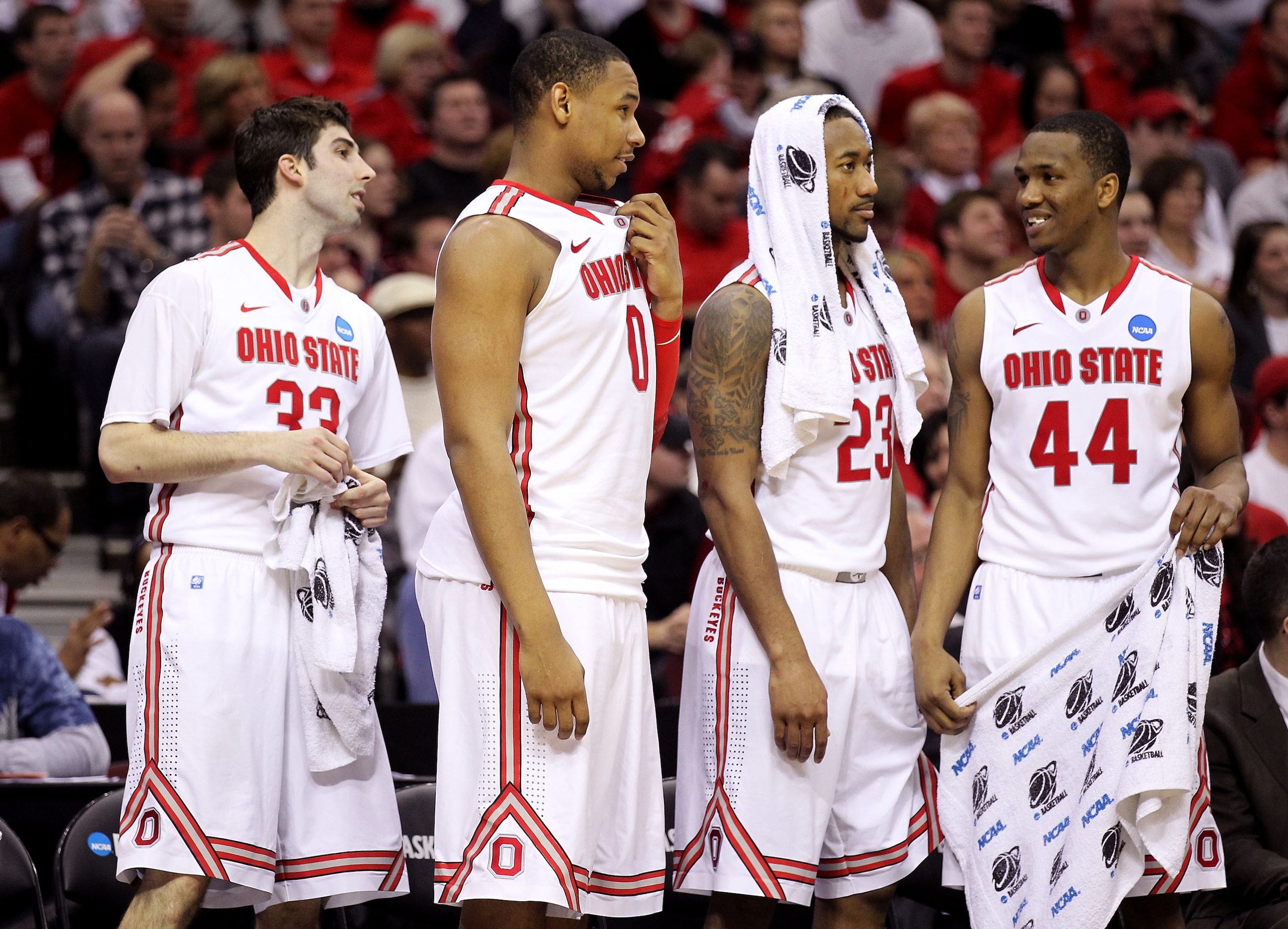 CLEVELAND, OH - MARCH 18: Jon Diebler #33, Jared Sullinger #0, David Lighty #23 and William Buford #44 of the Ohio State Buckeyes look on from the bench late in the second half against the Texas-San Antonio Roadrunners during the second round of the 2011