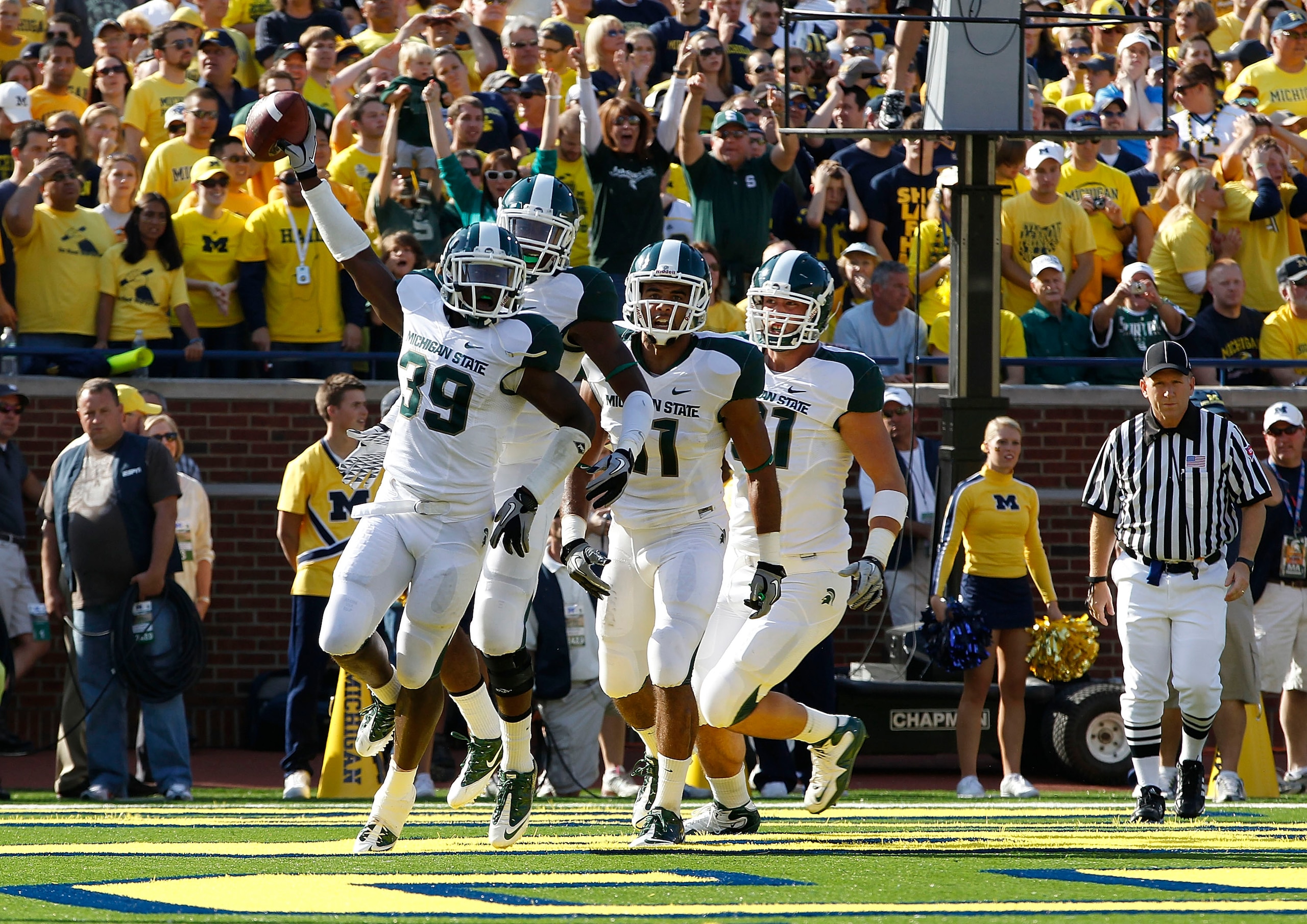 ANN ARBOR, MI - OCTOBER 09: Trenton Robinson #39 of the Michigan State Spartans celebrates a first quarter interception off a pass from Denard Robinson #16 of the Michigan Wolverines during the game on October 9, 2010 at Michigan Stadium in Ann Arbor, Mic