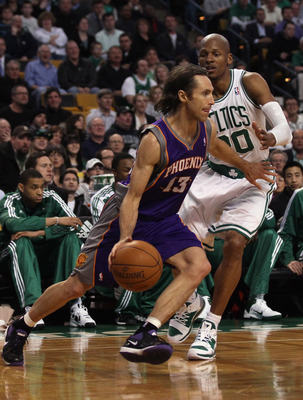 BOSTON, MA - MARCH 02:  Steve Nash #13 of the Phoenix Suns drives around Ray Allen #20 of the Boston Celtics on March 2, 2011 at the TD Garden in Boston, Massachusetts.  The Celtics defeated the Suns 115-103. NOTE TO USER: User expressly acknowledges and