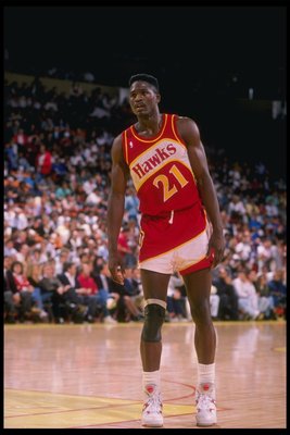 Forward Dominique Wilkins of the Atlanta Hawks stands on the court during a game.