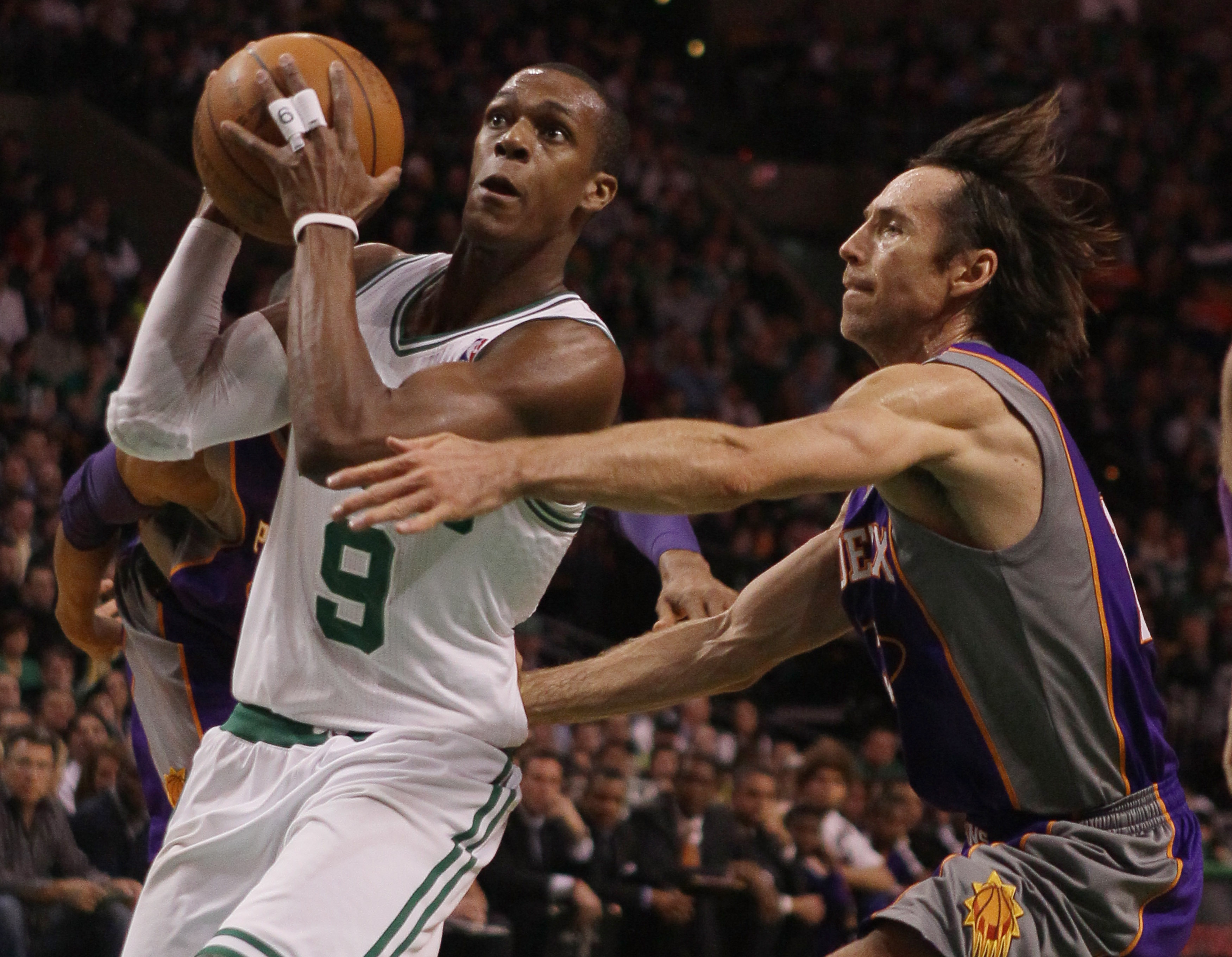 BOSTON, MA - MARCH 02:  Rajon Rondo #9 of the Boston Celtics heads for the net as Steve Nash #13 of the Phoenix Suns defends on March 2, 2011 at the TD Garden in Boston, Massachusetts.  NOTE TO USER: User expressly acknowledges and agrees that, by downloa