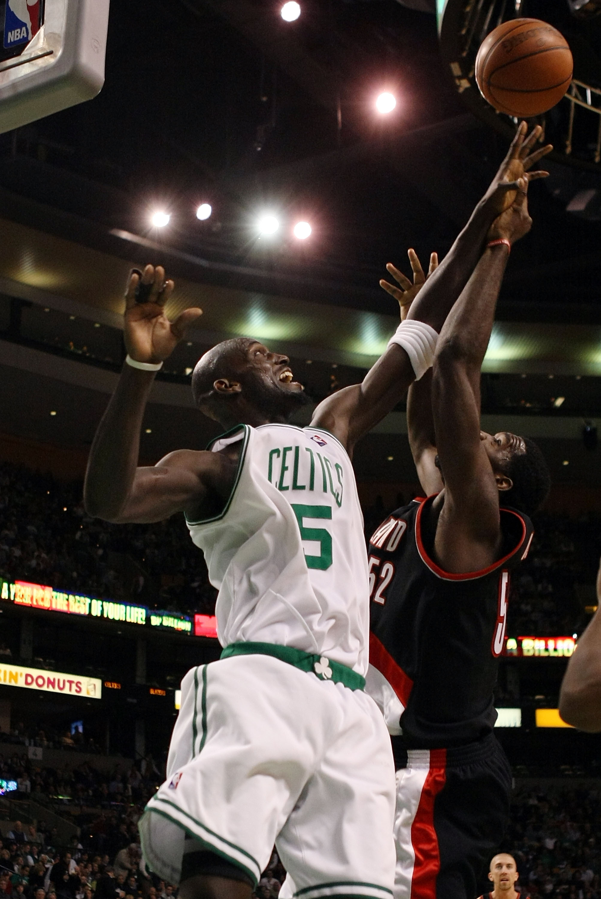 BOSTON - DECEMBER 05:  Kevin Garnett #5 of the Boston Celtics tries to block a shot from Greg Oden #52 of the Portland Trail Blazers on December 5, 2008 at TD Banknorth Garden in Boston, Massachusetts. The Celtics defeated the Trail Blazers 93-78.  NOTE T