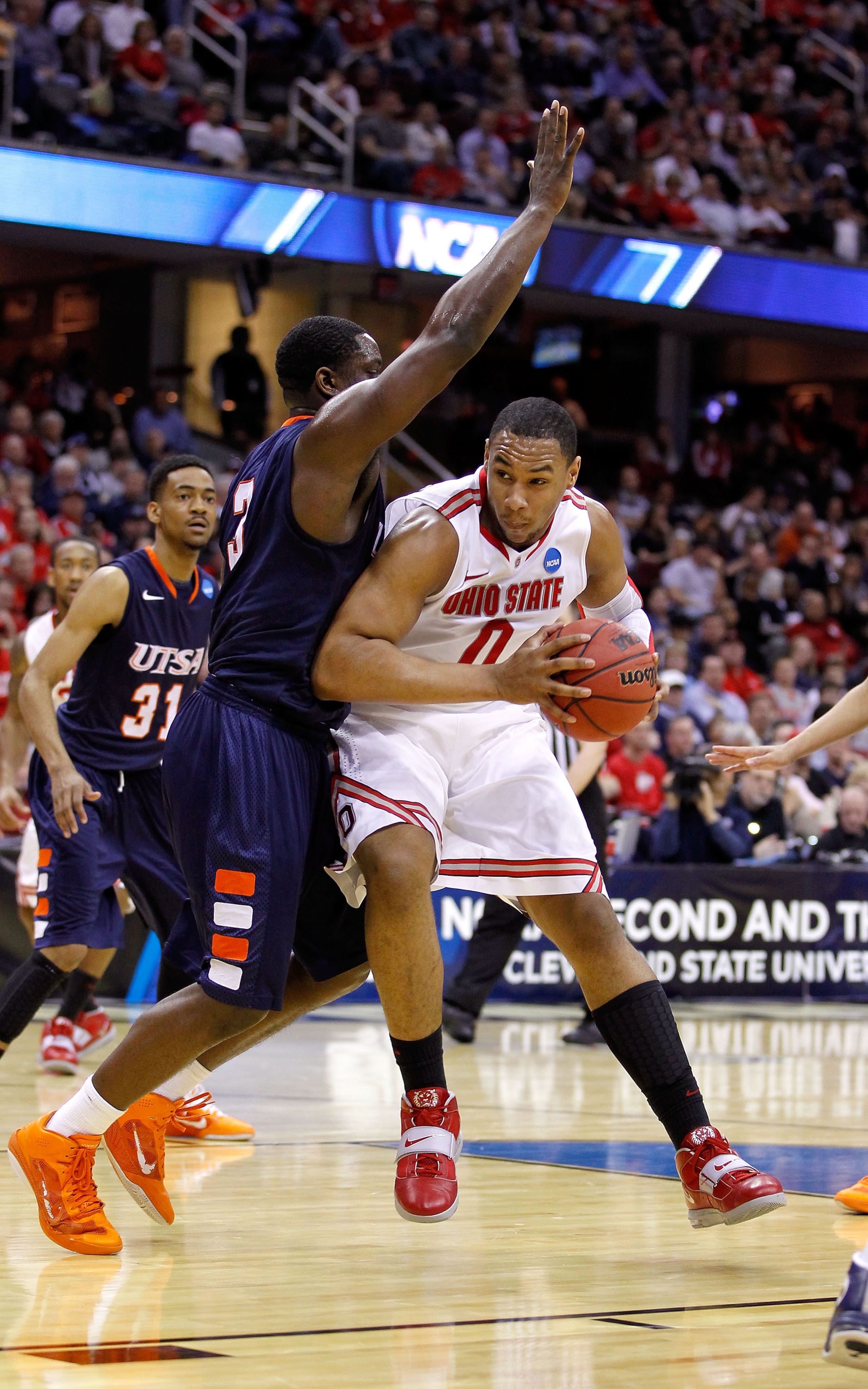CLEVELAND, OH - MARCH 18: Jared Sullinger #0 of the Ohio State Buckeyes drives with the ball against Larry Wilkins #3 of the Texas-San Antonio Roadrunners during the second round of the 2011 NCAA men's basketball tournament at Quicken Loans Arena on March