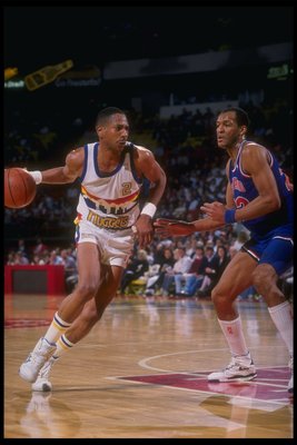 1989-1990:  Guard Alex English of the Denver Nuggets moves the ball during a game versus the Cleveland Cavaliers at the McNichols Sports Arena in Denver, Colorado. Mandatory Credit: Tim DeFrisco  /Allsport Mandatory Credit: Tim DeFrisco  /Allsport