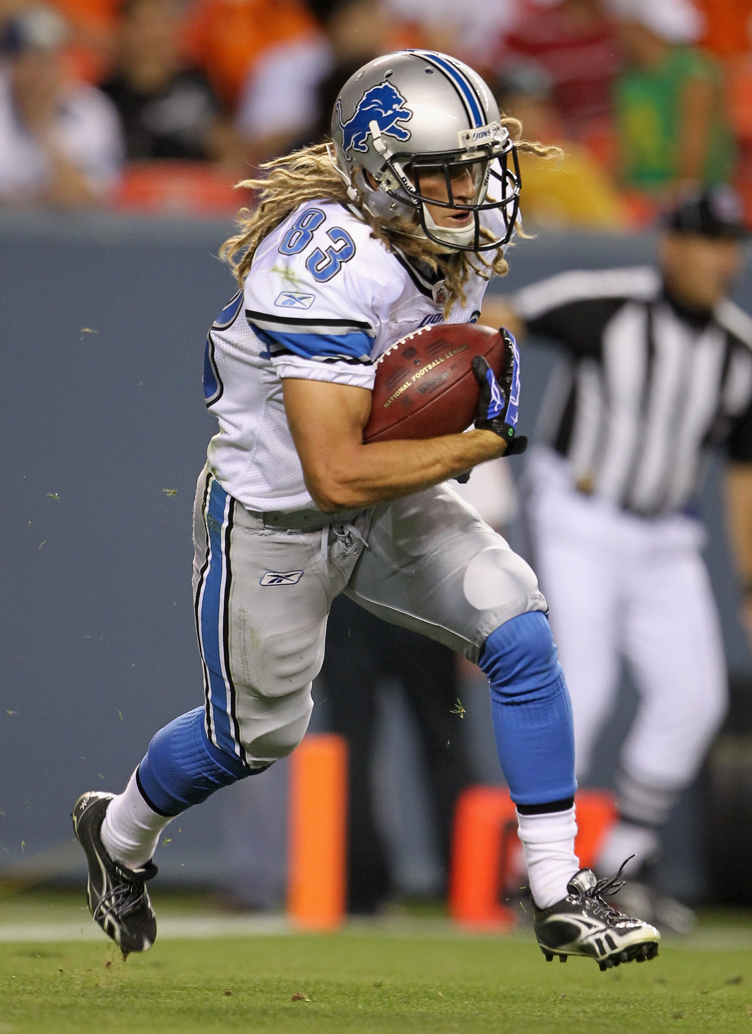 DENVER - AUGUST 21:  Tim Toone #83 of the Detroit Lions runs back a kick off against the Denver Broncos during preseason NFL action at INVESCO Field at Mile High on August 21, 2010 in Denver, Colorado. The Lions defeated the Broncos 25-20.  (Photo by Doug