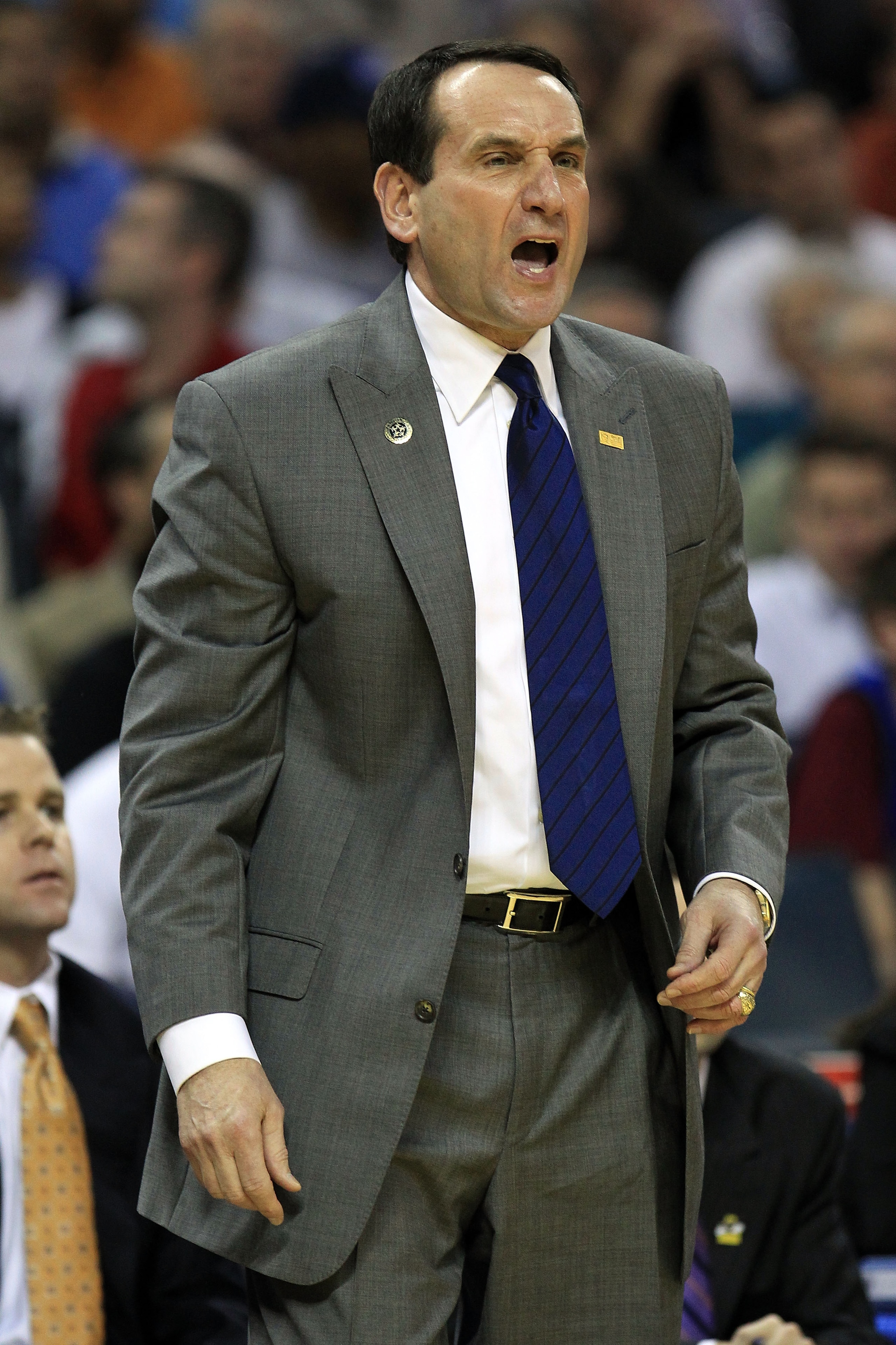 CHARLOTTE, NC - MARCH 18:  Head coach Mike Krzyzewski of the Duke Blue Devils reacts in the first half while taking on the Hampton Pirates during the second round of the 2011 NCAA men's basketball tournament at Time Warner Cable Arena on March 18, 2011 in