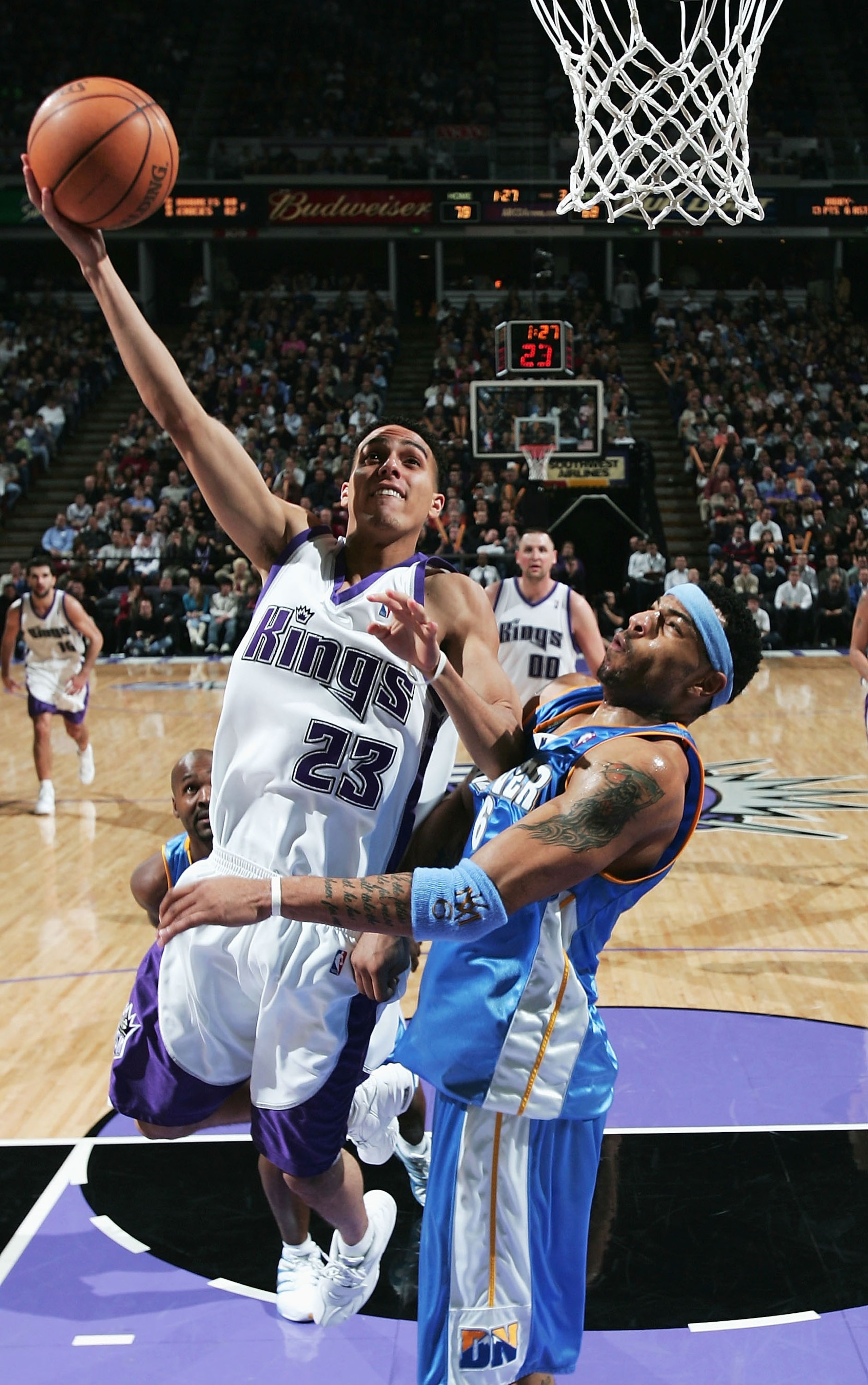 SACRAMENTO, CA - JANUARY 11:  Kevin Martin #23 of the Sacramento Kings shoots over Kenyon Martin #6 of the Denver Nuggets on January 11, 2005 at Arco Arena in Sacramento, California.  NOTE TO USER: User expressly acknowledges and agrees that, by downloadi