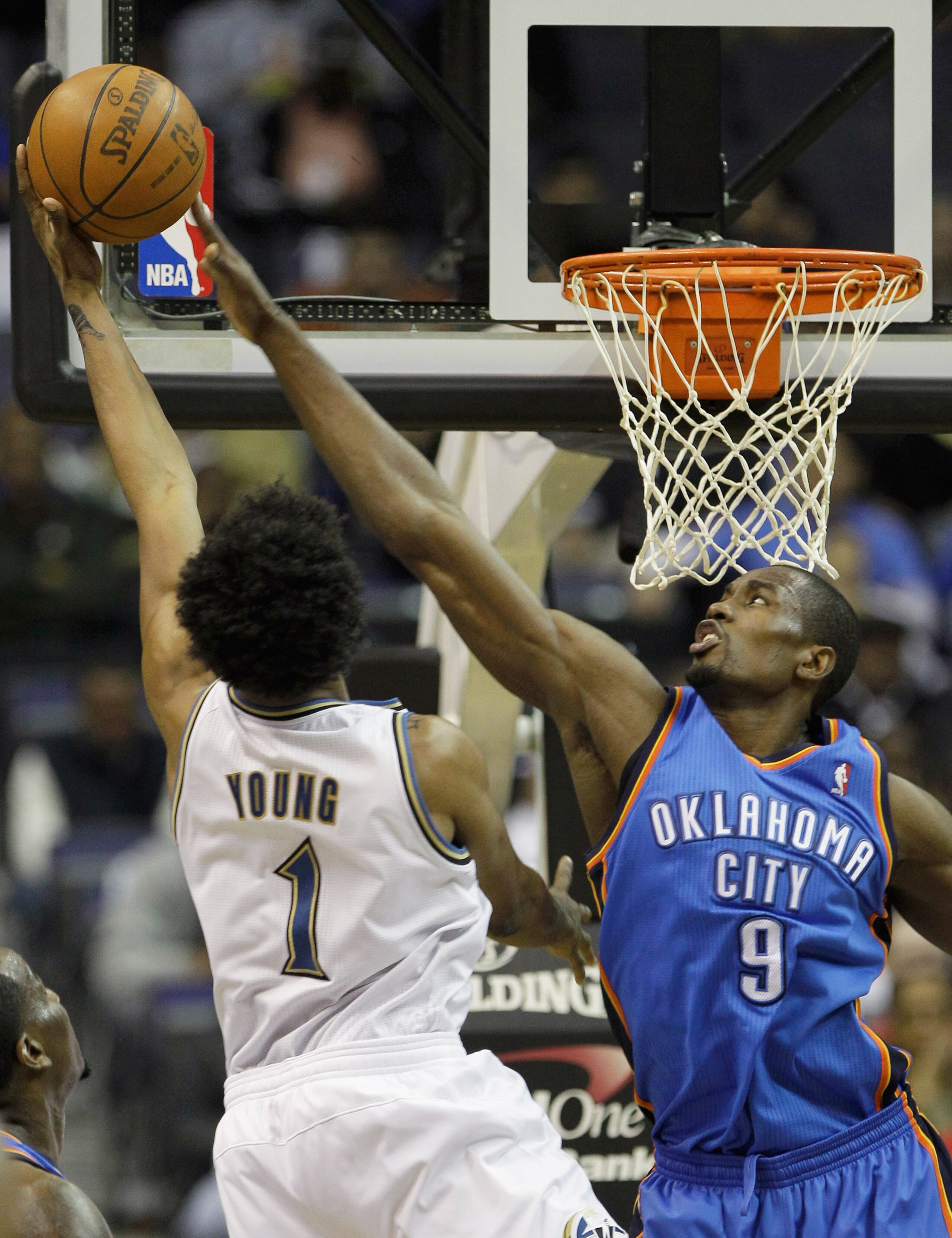 WASHINGTON, DC - MARCH 14: Serge Ibaka #9 of the Oklahoma City Thunder blocks a shot by Nick Young #1 of the Washington Wizards during the first half at the Verizon Center on March 14, 2011 in Washington, DC. NOTE TO USER: User expressly acknowledges and