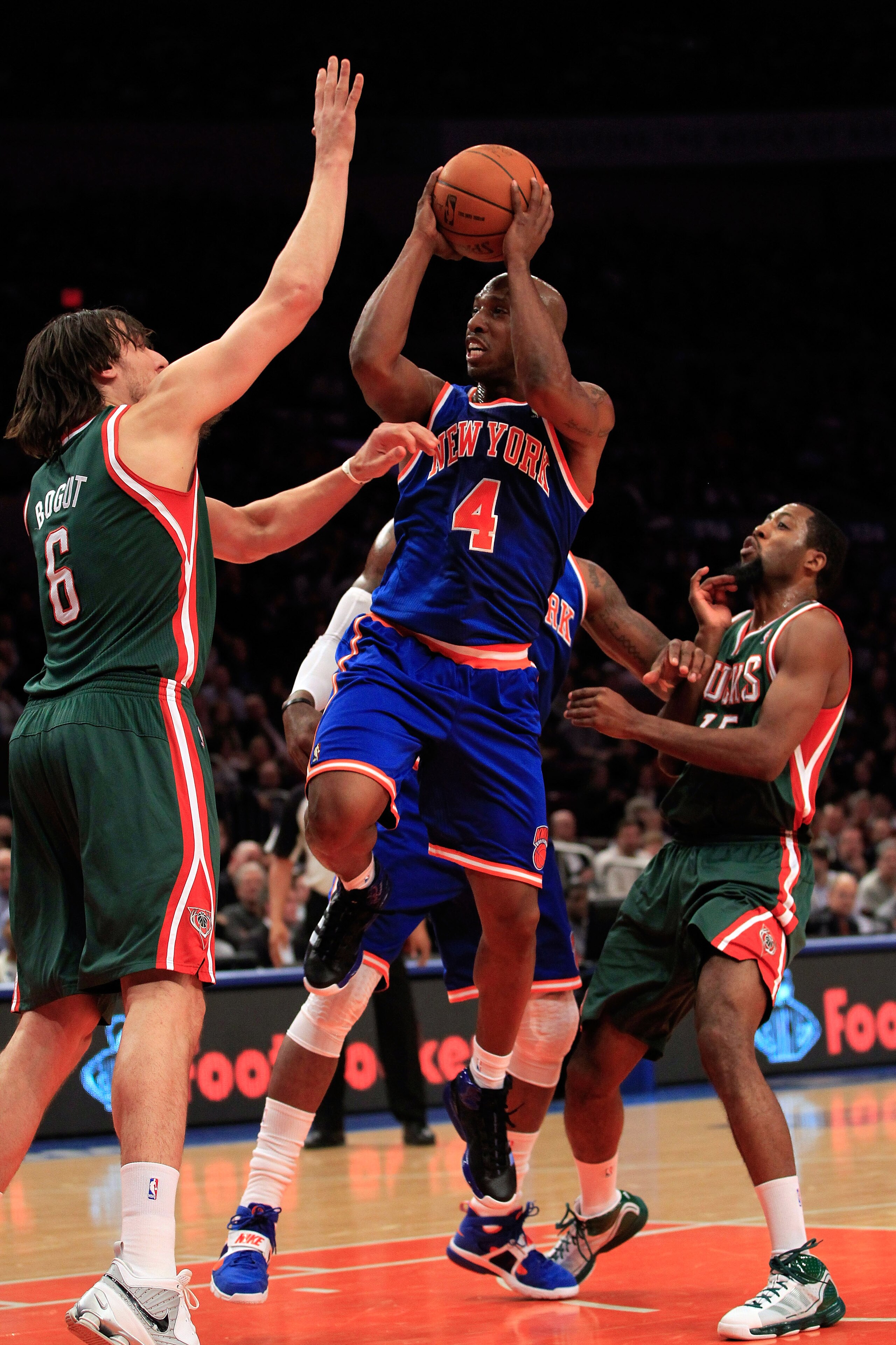 NEW YORK, NY - FEBRUARY 23:  Chauncey Billups # 4 of the New York Knicks goes up for a basket against Andrew Bogut #6 of the Milwaukee Bucks at Madison Square Garden on February 23, 2011 in New York City. NOTE TO USER: User expressly acknowledges and agre
