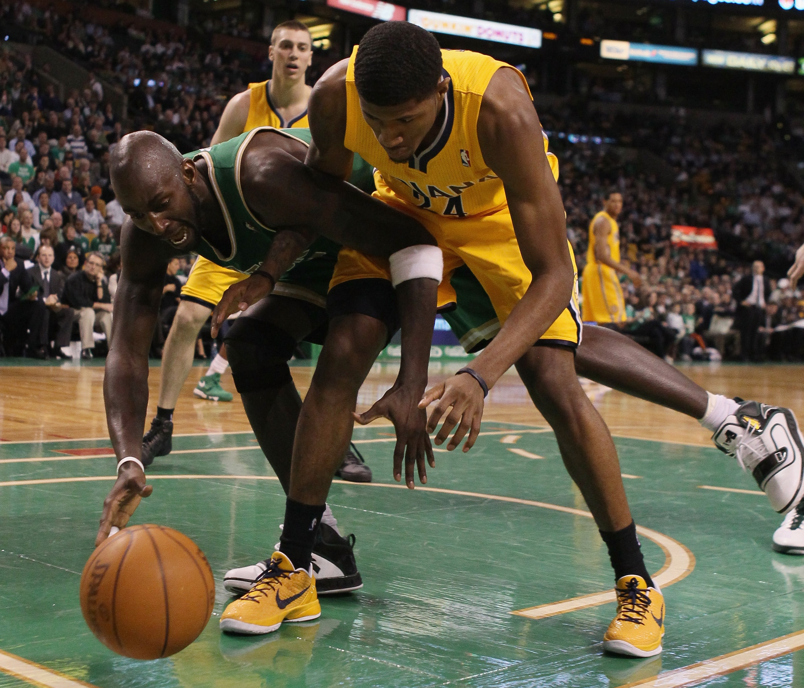 BOSTON, MA - MARCH 16:  Kevin Garnett #5 of the Boston Celtics and Paul George #24 of the Indiana Pacers go after the ball on March 16, 2011 at the TD Garden in Boston, Massachusetts. The Celtics defeated the Indiana Pacers 92-80. NOTE TO USER: User expre