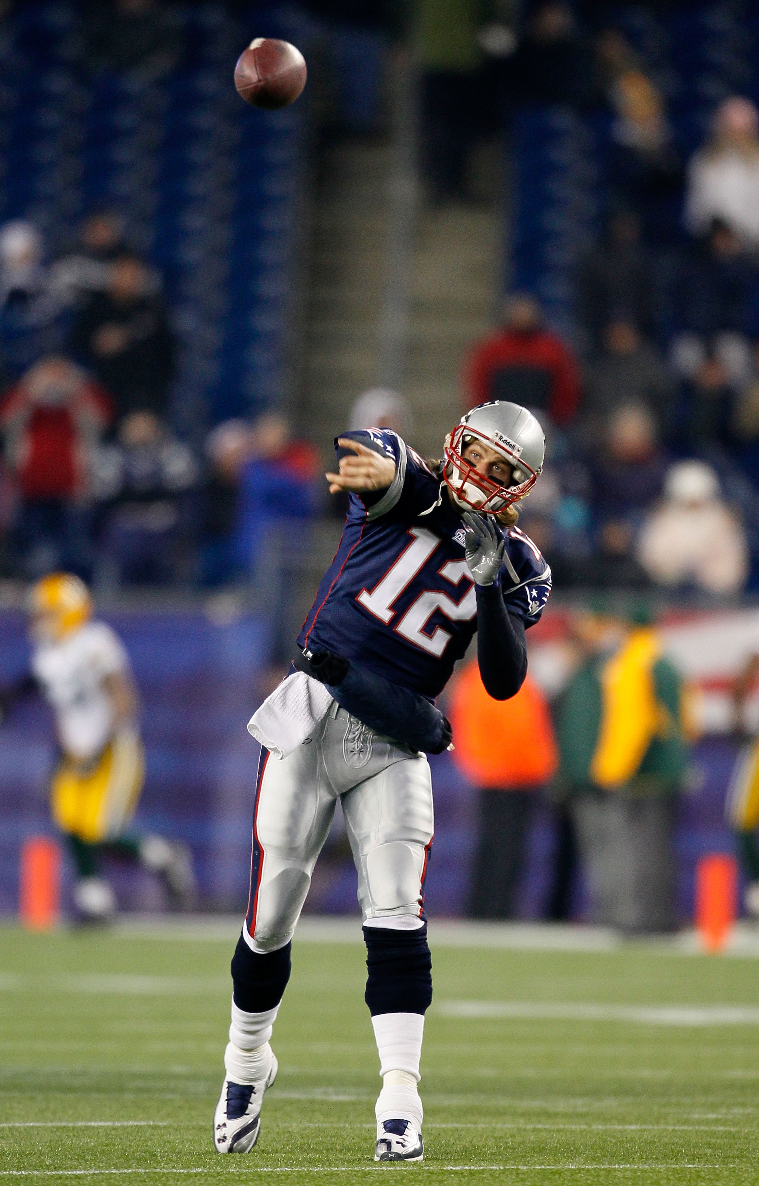 FOXBORO, MA - DECEMBER 19: Quarterback Tom Brady #12 of the New England Patriots throws a pass during warm-ups before playing against the Green Bay Packers at Gillette Stadium on December 19, 2010 in Foxboro, Massachusetts. (Photo by Jim Rogash/Getty Im FOXBORO, MA - DECEMBER 19: Quarterback Tom Brady #12 of the New England Patriots throws a pass during warm-ups before playing against the Green Bay Packers at Gillette Stadium on December 19, 2010 in Foxboro, Massachusetts. (Photo by Jim Rogash/Getty Im