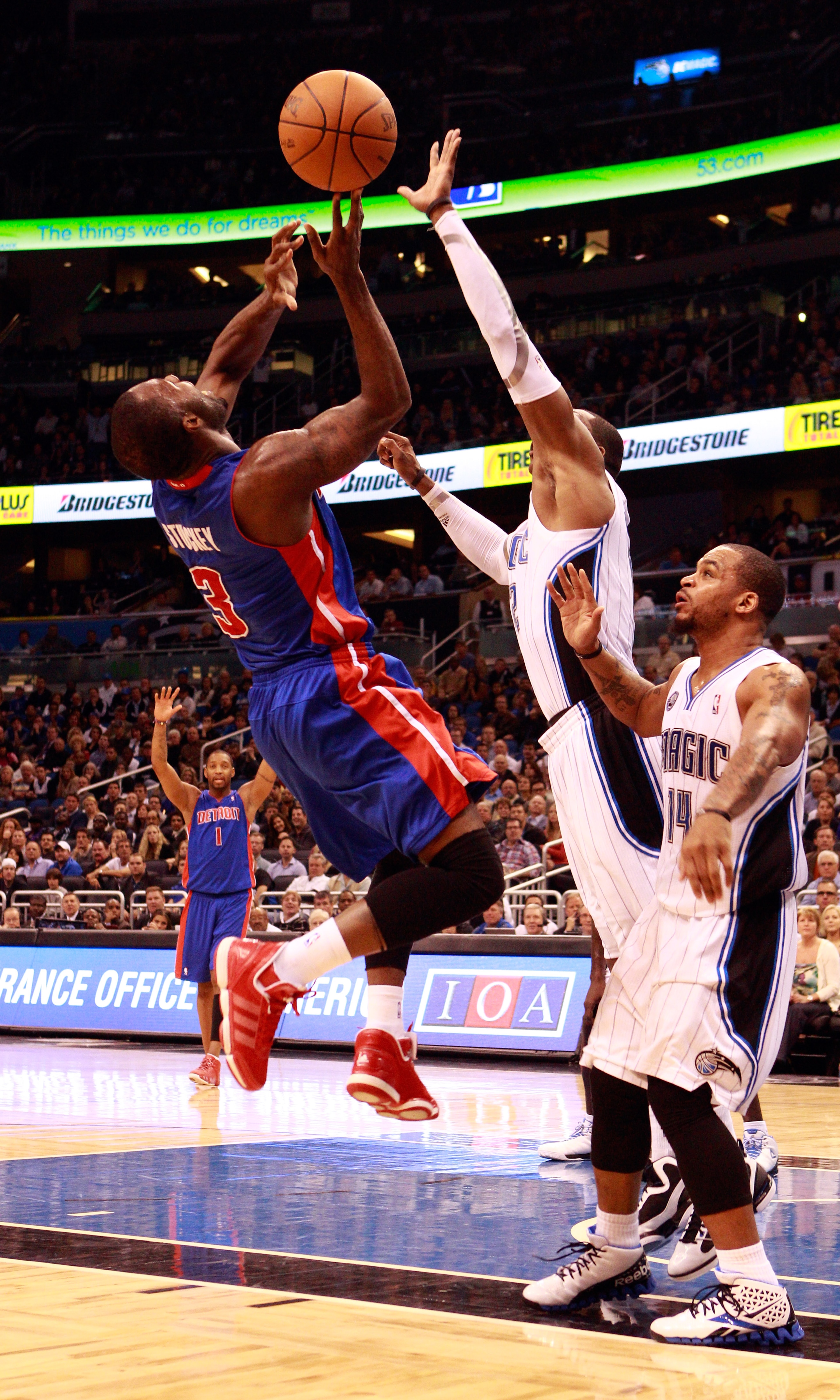 ORLANDO, FL - JANUARY 24: Rodney Stuckey #3 of the Detroit Pistons attempts a shot against Dwight Howard #12 and Jameer Nelson #14 of the Orlando Magic during the game at Amway Arena on January 24, 2011 in Orlando, Florida. NOTE TO USER: User expressly ORLANDO, FL - JANUARY 24: Rodney Stuckey #3 of the Detroit Pistons attempts a shot against Dwight Howard #12 and Jameer Nelson #14 of the Orlando Magic during the game at Amway Arena on January 24, 2011 in Orlando, Florida. NOTE TO USER: User expressly