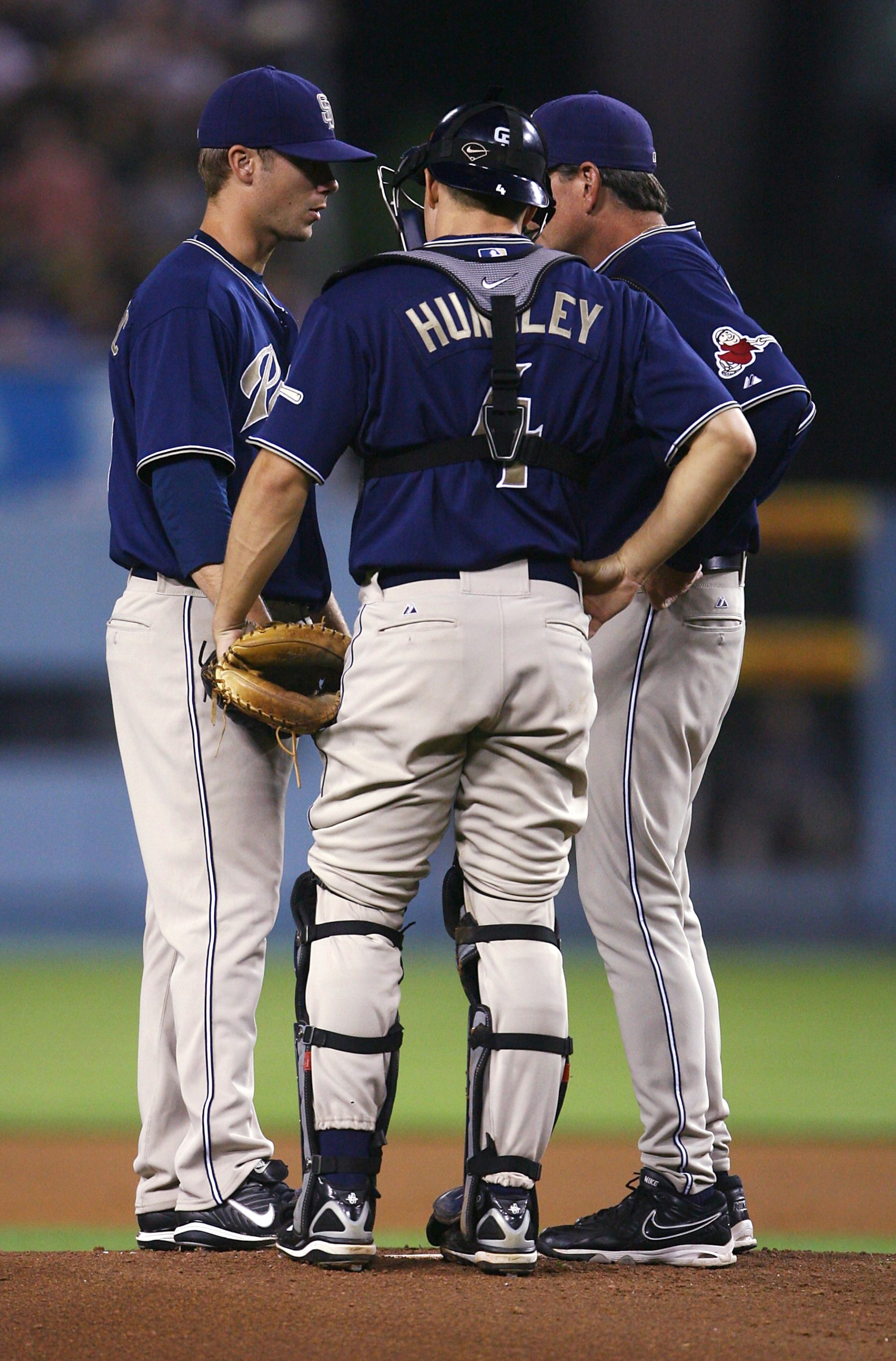 LOS ANGELES, CA - SEPTEMBER 23:  Wade LeBlanc #58 (L) of the San Diego Padres meets on the mound with catcher Nick Hundley #4 and pitching coach Darren Balsley #36 at Dodger Stadium September 23, 2008 in Los Angeles, California. (Jeff Gross/Getty Images)