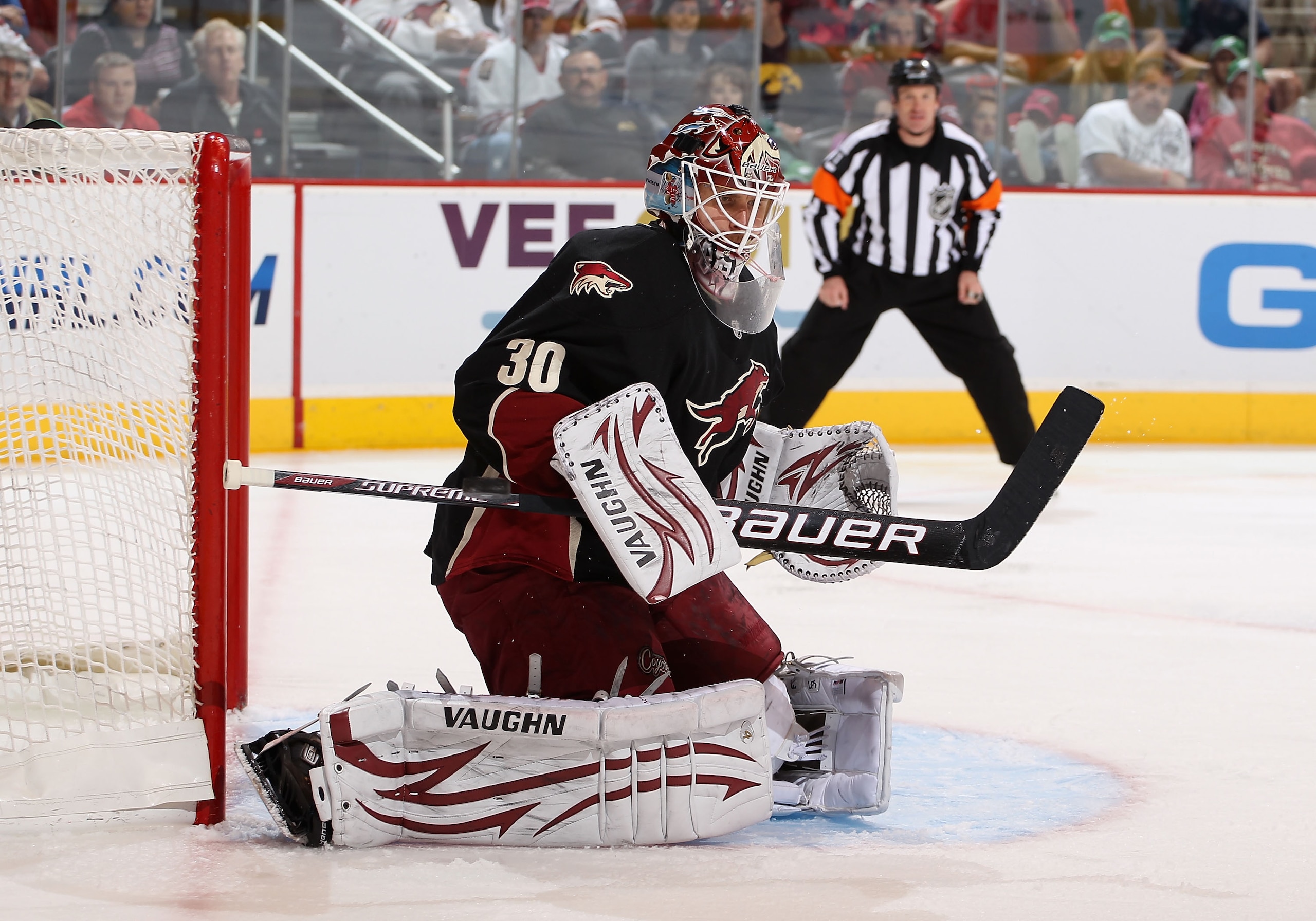 GLENDALE, AZ - MARCH 10:  Goaltender Ilya Bryzgalov #30 of the Phoenix Coyotes makes a pad save during the NHL game against the Calgary Flames at Jobing.com Arena on March 10, 2011 in Glendale, Arizona.  The Coyotes defeated the Flames 3-0.  (Photo by Chr