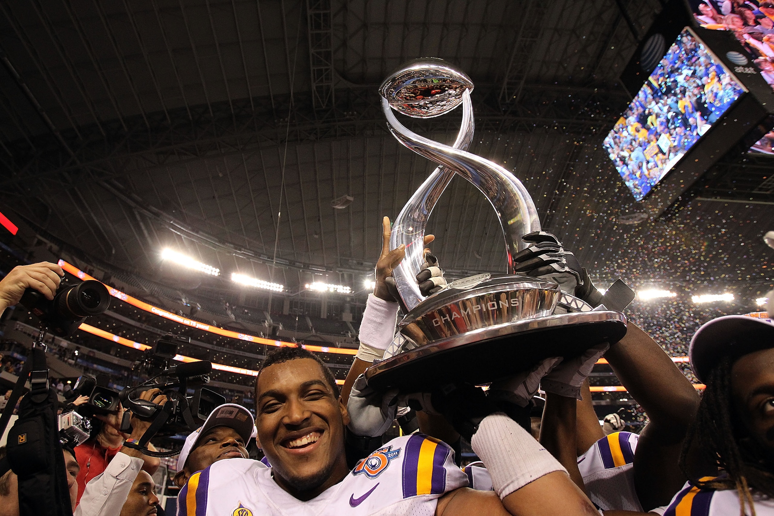 ARLINGTON, TX - JANUARY 07:  Joseph Barksdale #78 of the LSU Tigers holds the trophy while celebrating a 41-24 win against the Texas A&M Aggies during the AT&T Cotton Bowl at Cowboys Stadium on January 7, 2011 in Arlington, Texas.  (Photo by Ronald Martin