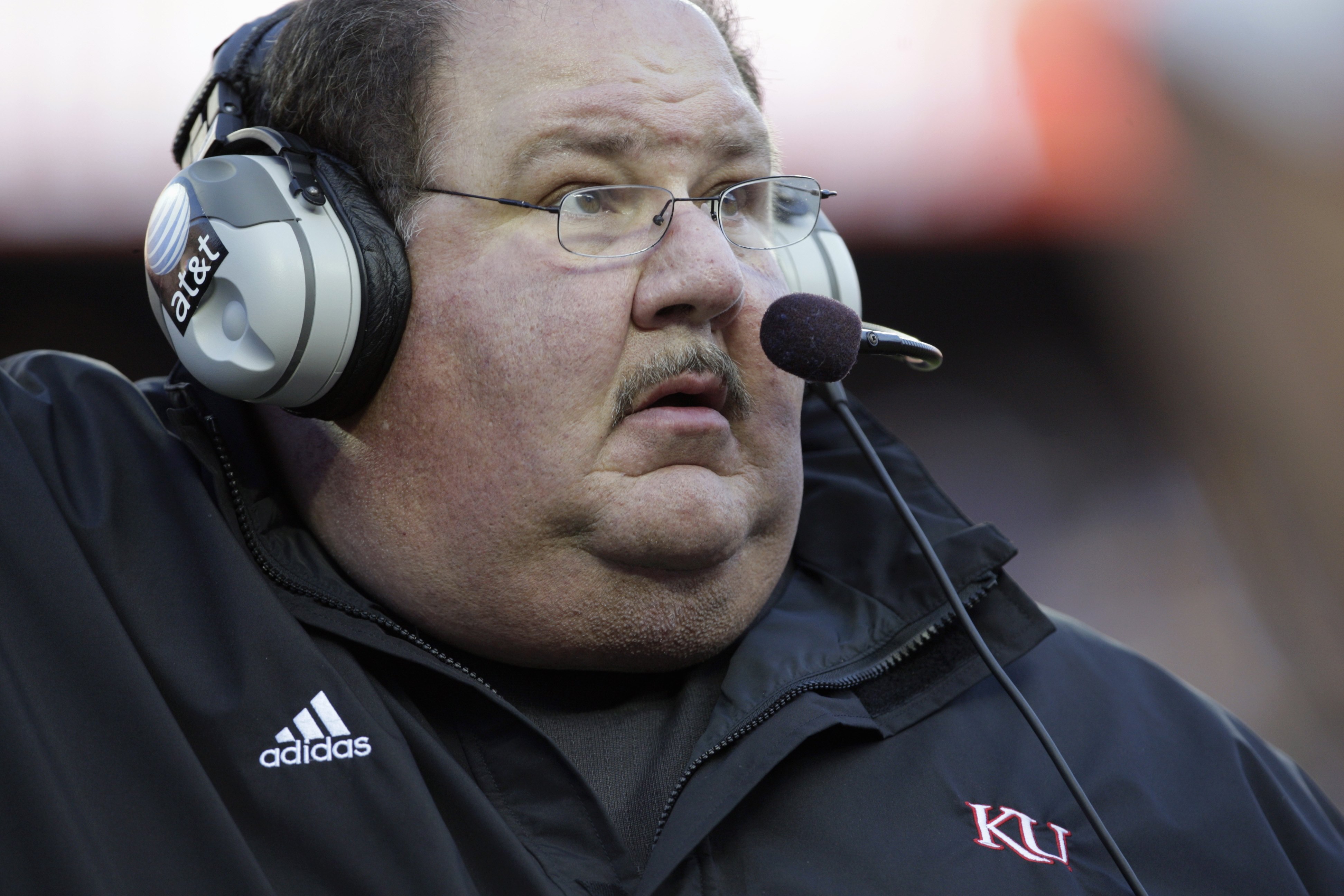 KANSAS CITY, MO - NOVEMBER 28:  Head coach Mark Mangino of the Kansas Jayhawks looks on during the game against the Missouri Tigers at Arrowhead Stadium on November 28, 2009 in Kansas City, Missouri. (Photo by Jamie Squire/Getty Images)