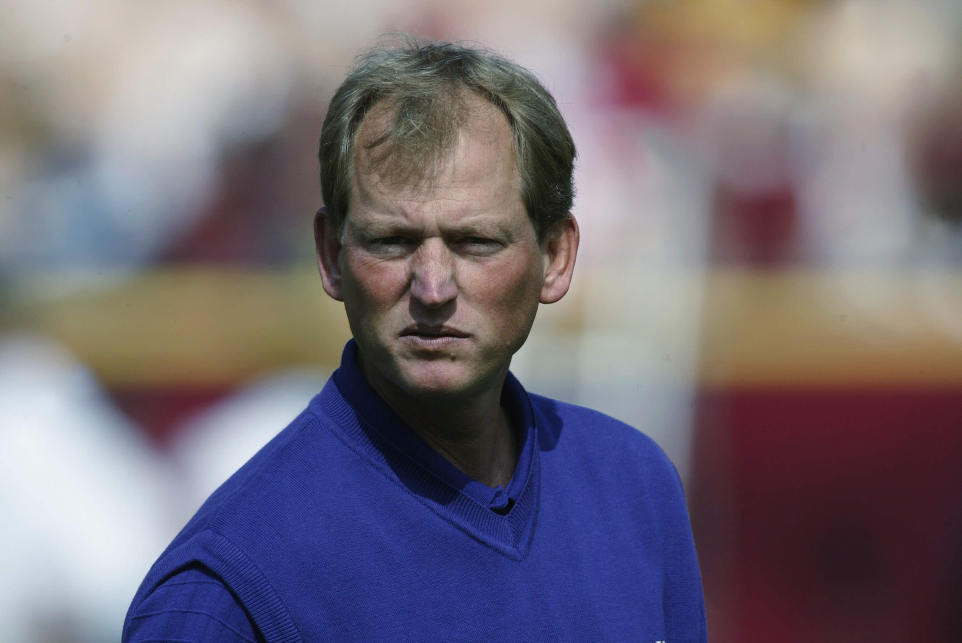 LOS ANGELES - OCTOBER 19:  Head coach Rick Neuheisel of the Washington Huskies stands on the field before the Pac-10 Conference football game against the USC Trojans at the Los Angeles Coliseum on October 19,  2002 in Los Angeles, California.  USC won 41-