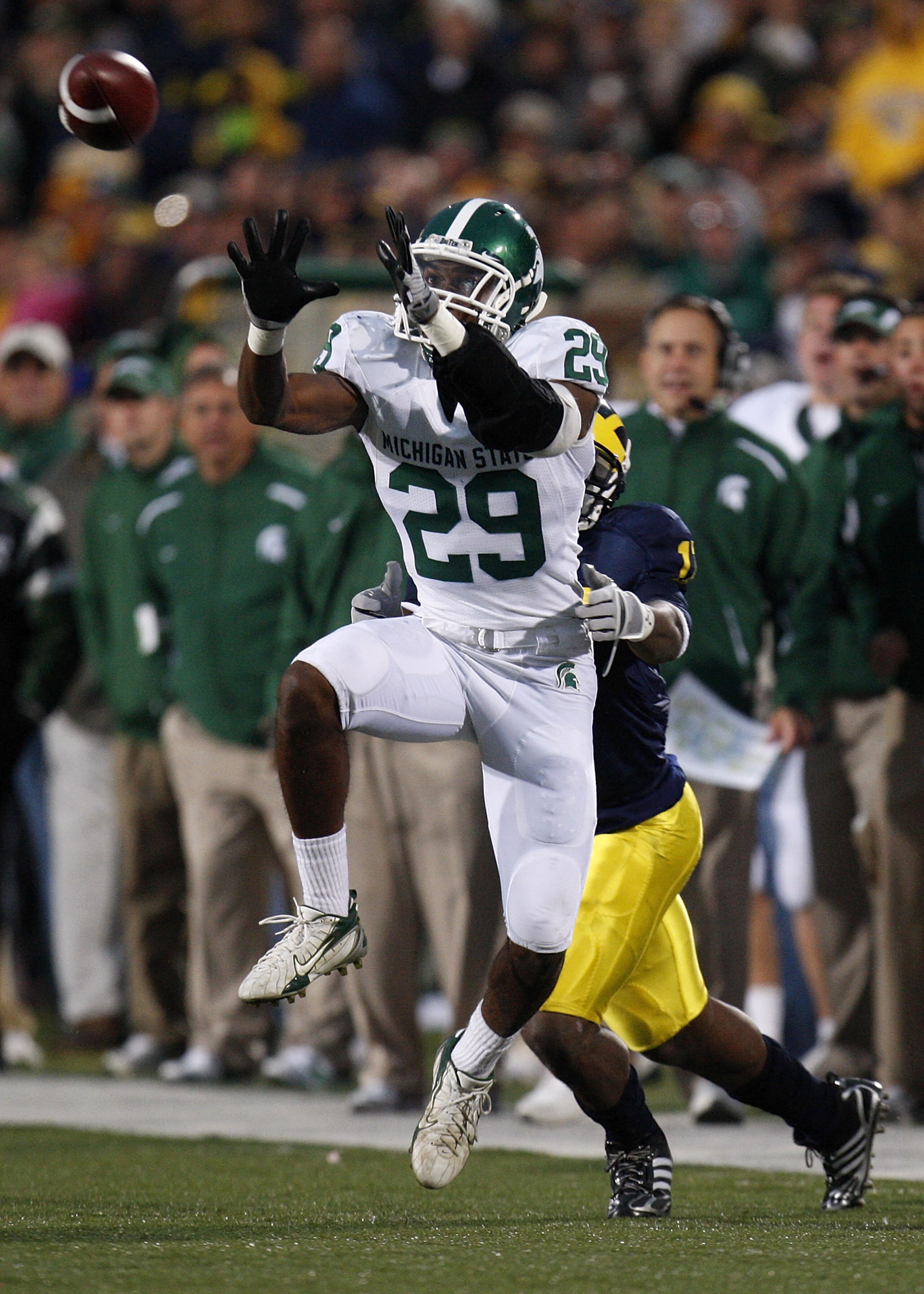ANN ARBOR, MI - OCTOBER 25: Chris L. Rucker of the Michigan State Spartans intercepts a fourth quarter pass in front of Toney Clemons #17 of the Michigan Wolverines on October 25, 2008 at Michigan Stadium in Ann Arbor, Michigan.  Michigan State won the ga