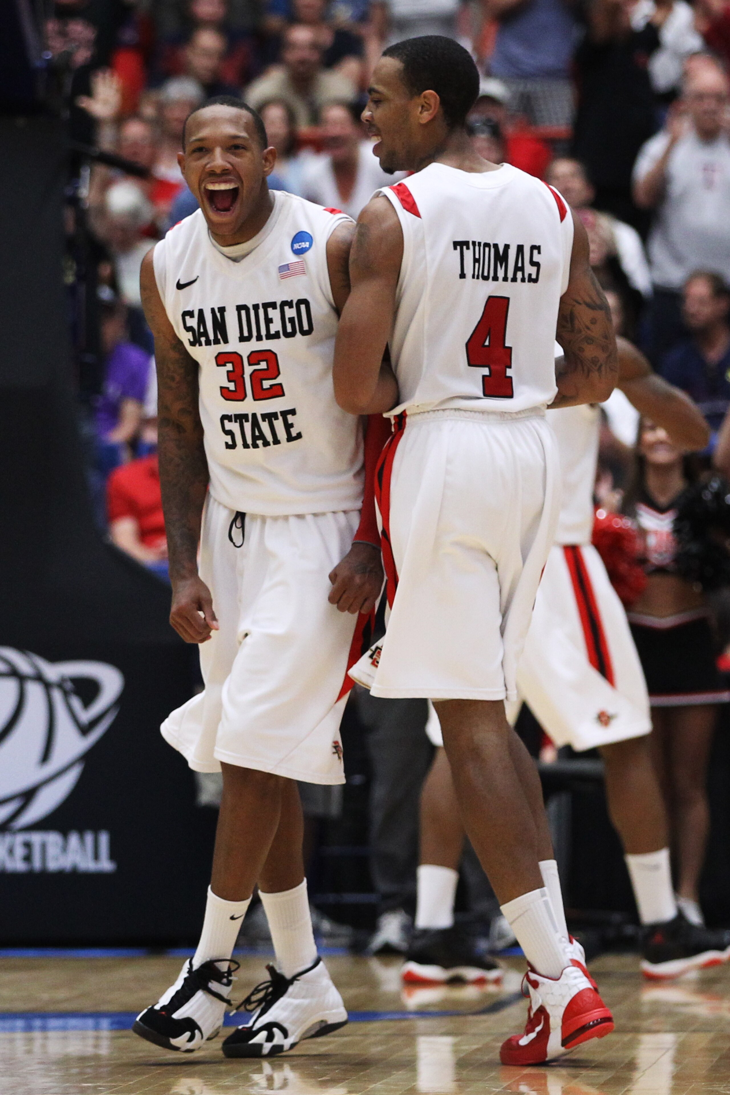 TUCSON, AZ - MARCH 19:  Malcolm Thomas #4 and Billy White #32 of the San Diego State Aztecs celebrate after defeating the Temple Owls 71 to 64 in double overtime during the third round of the 2011 NCAA men's basketball tournament at McKale Center on March