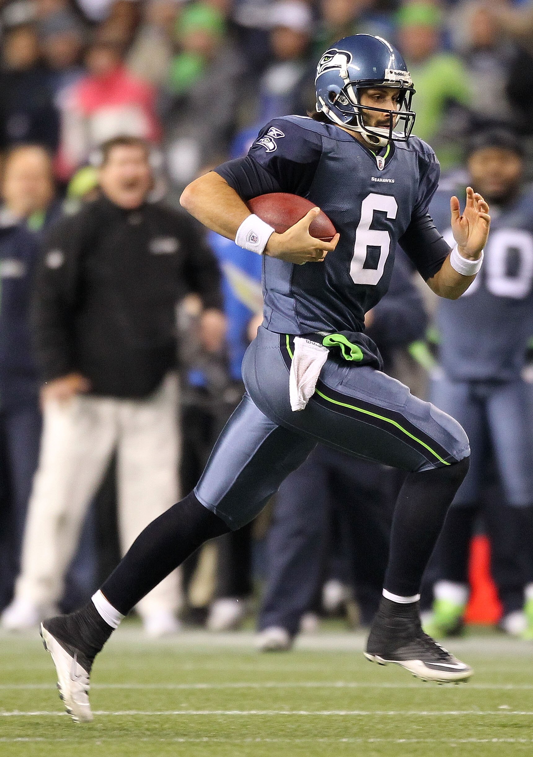 SEATTLE, WA - JANUARY 02:  Quarterback Charlie Whitehurst #6 of the Seattle Seahawks runs with the ball during their game against the St. Louis Rams at Qwest Field on January 2, 2011 in Seattle, Washington.  (Photo by Otto Greule Jr/Getty Images)