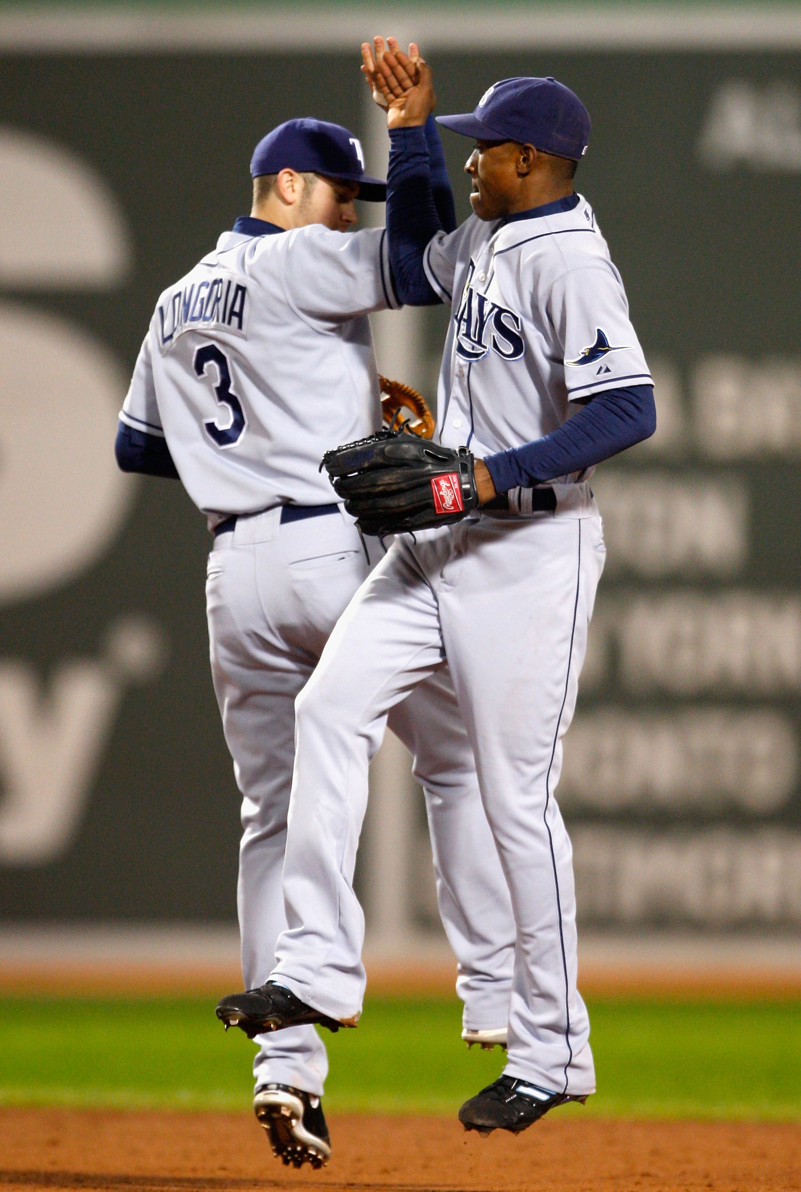 BOSTON - OCTOBER 13:  B.J. Upton #2 of the Tampa Bay Rays celebrates with teammate Evan Longoria #3 afte defeating The Boston Red Sox in game three of the American League Championship Series during the 2008 MLB playoffs at Fenway Park on October 13, 2008