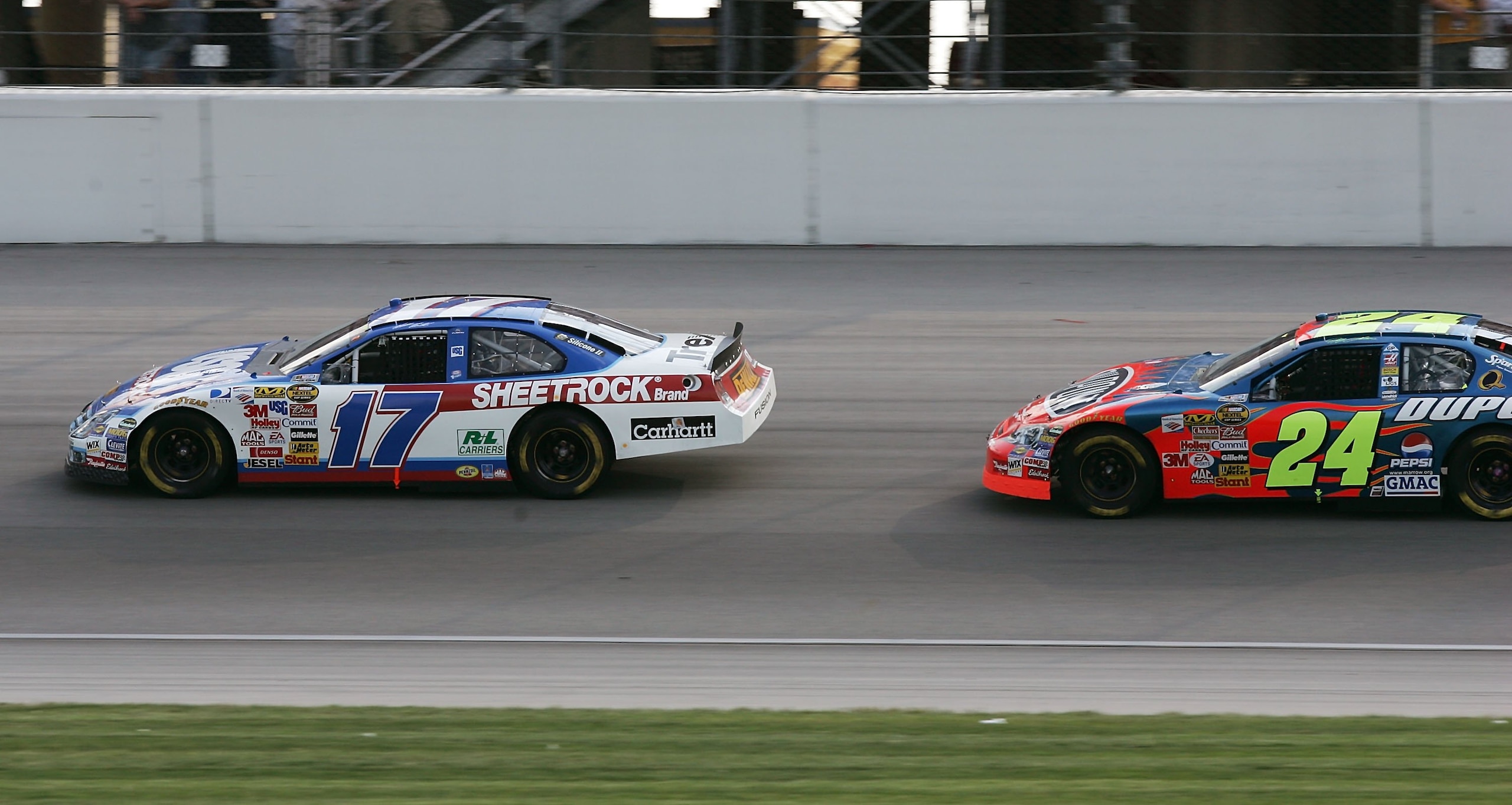 JOLIET, IL - JULY 09:  Matt Kenseth, driver of the #17 USG/DeWalt Ford, leads Jeff Gordon, driver of the #24 DuPont Chevrolet, during the NASCAR Nextel Cup Series USG Sheetrock 400 on July 9, 2006 at Chicagoland Speedway in Joliet, Illinois.  (Photo by Jo