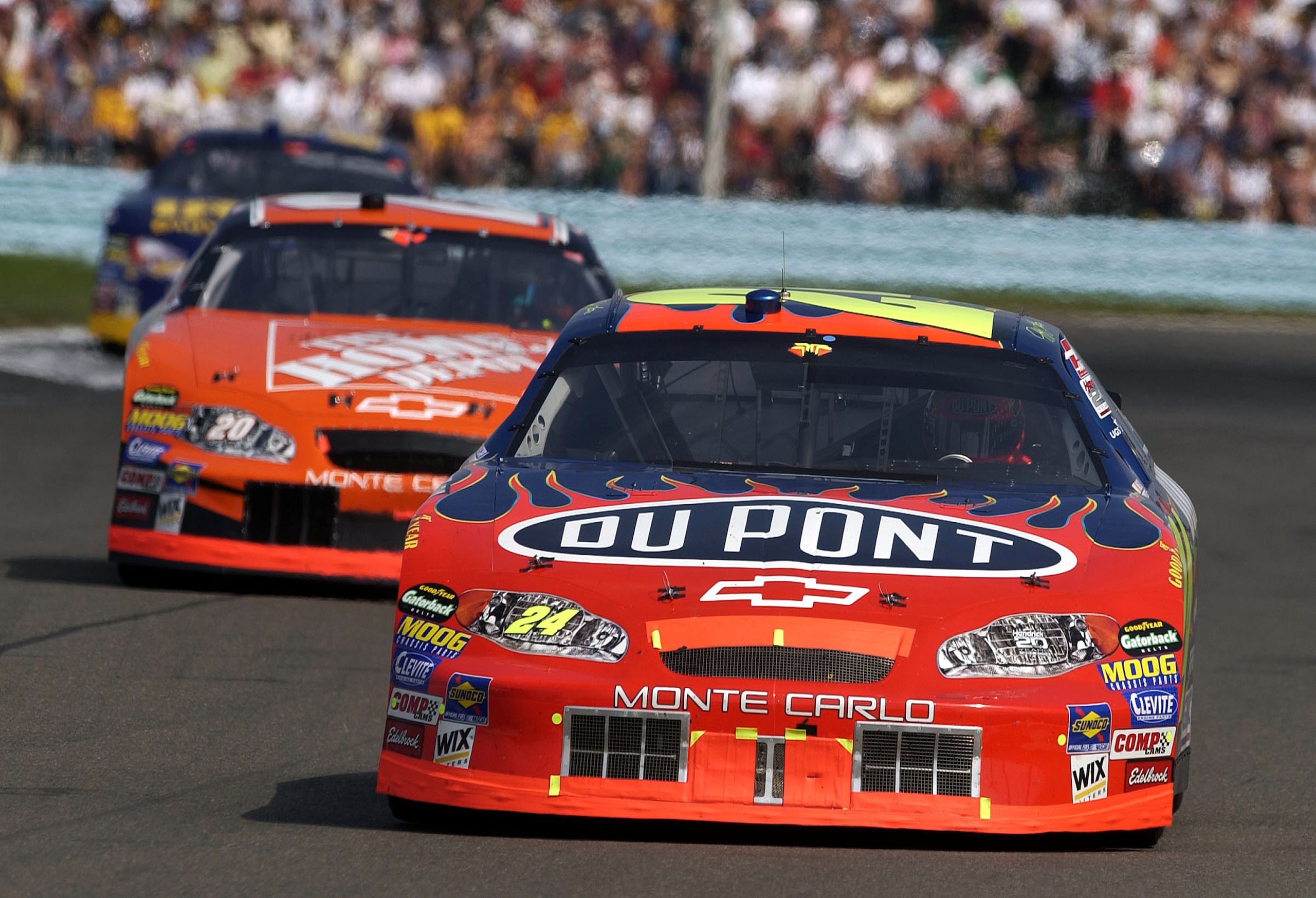 WATKINS GLEN, NY - AUGUST 15:  Jeff Gordon, driver of the #24 Dupont Chevrolet, leads eventual winner Tony Stewart, driver of the #20 Home Depot Chevrolet, during the Nextel Cup series Sirius at the Glen on August 15, 2004 at Watkins Glen International Sp