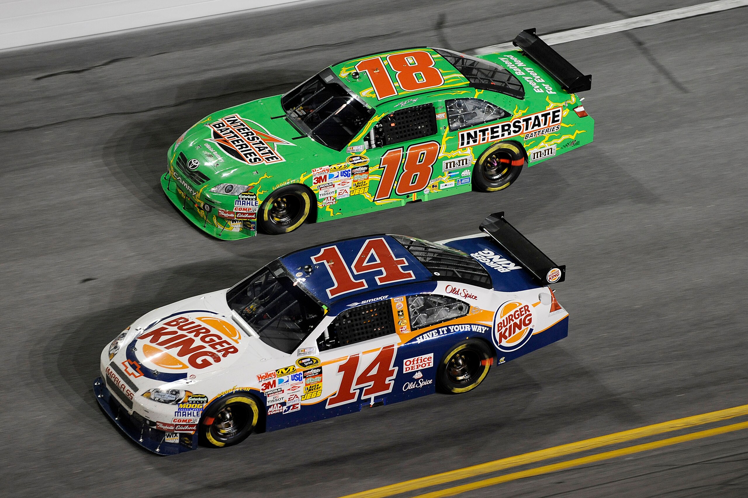 DAYTONA BEACH, FL - JULY 04: Tony Stewart, driver of the #14 Burger King Chevrolet, leads Kyle Busch, driver of the #18 Interstate Battereis Toyota, during the NASCAR Sprint Cup Series 51st Annual Coke Zero 400 at Daytona International Speedway on July 4,