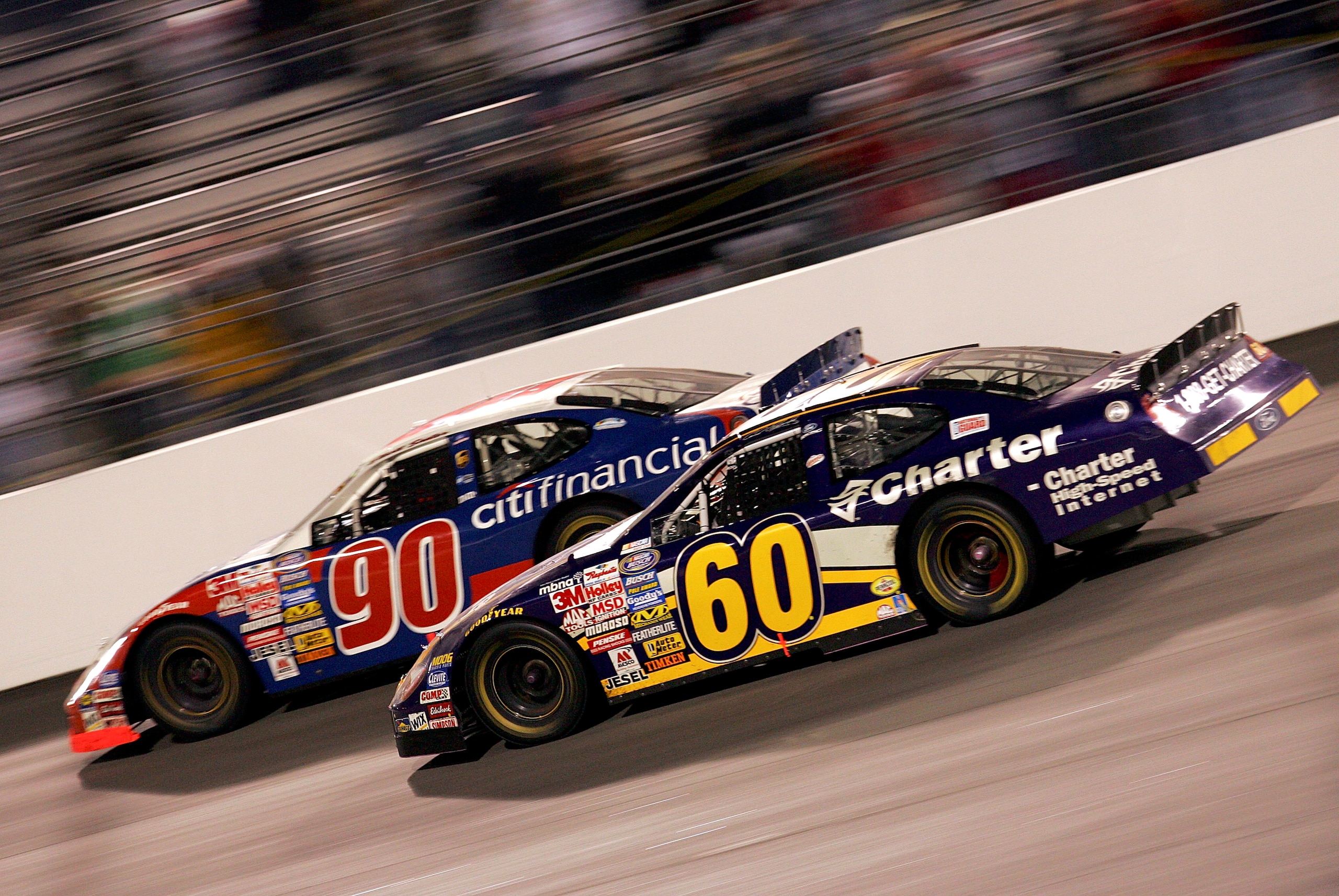 RICHMOND, VA - MAY 13:  Carl Edwards, driver of the #60 Roush Racing Ford, makes a move to pass Elliott Sadler, driver of the #90 CITI Financial Ford, on the final lap to win the NASCAR Busch Series Funai 250 on May 13, 2005 at the Richmond International 