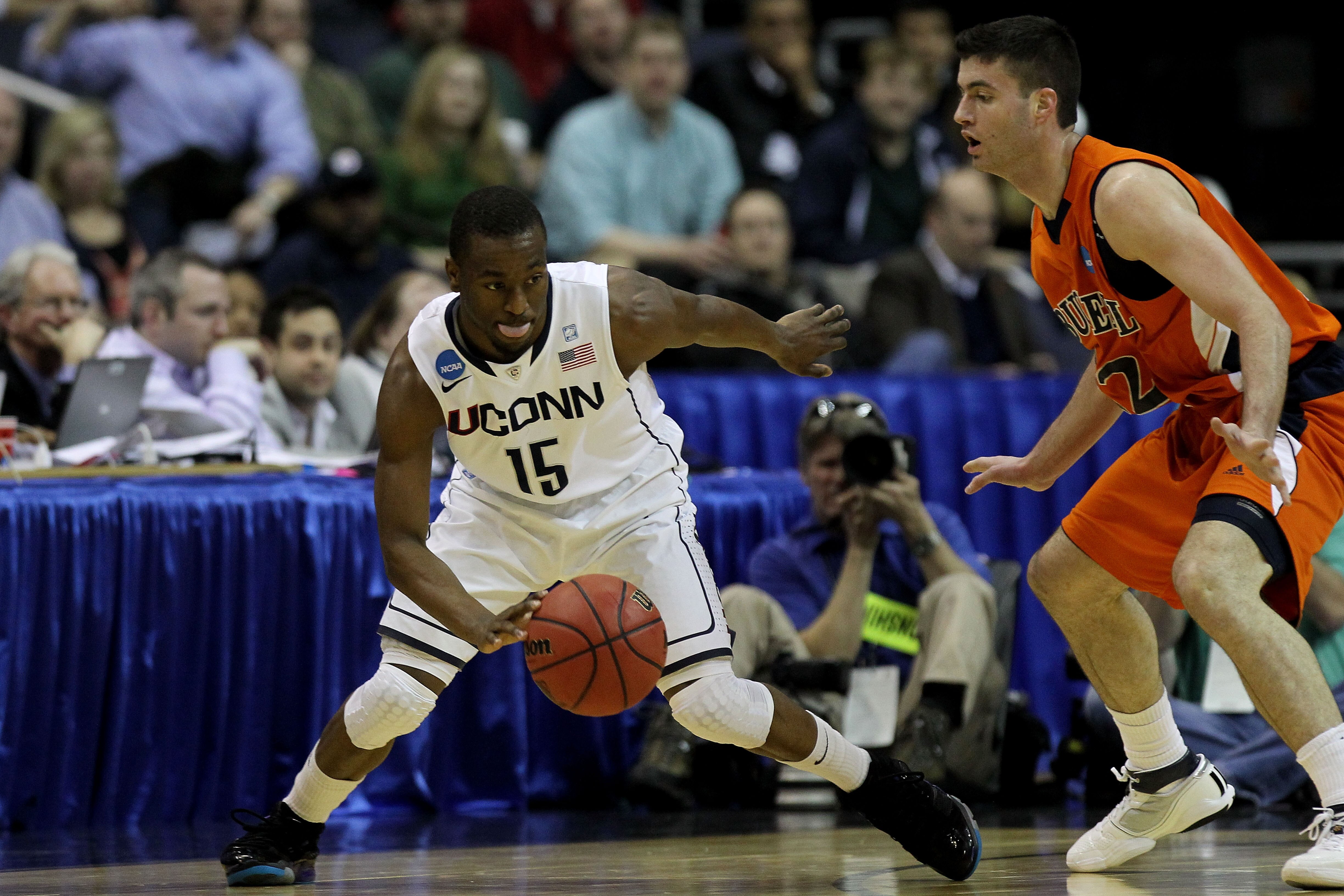 WASHINGTON - MARCH 17:  Kemba Walker #15 of the Connecticut Huskies dribbles around Bryan Cohen #22 of the Bucknell Bison during the second round of the 2011 NCAA men's basketball tournament at the Verizon Center on March 17, 2011 in Washington, DC.  (Pho