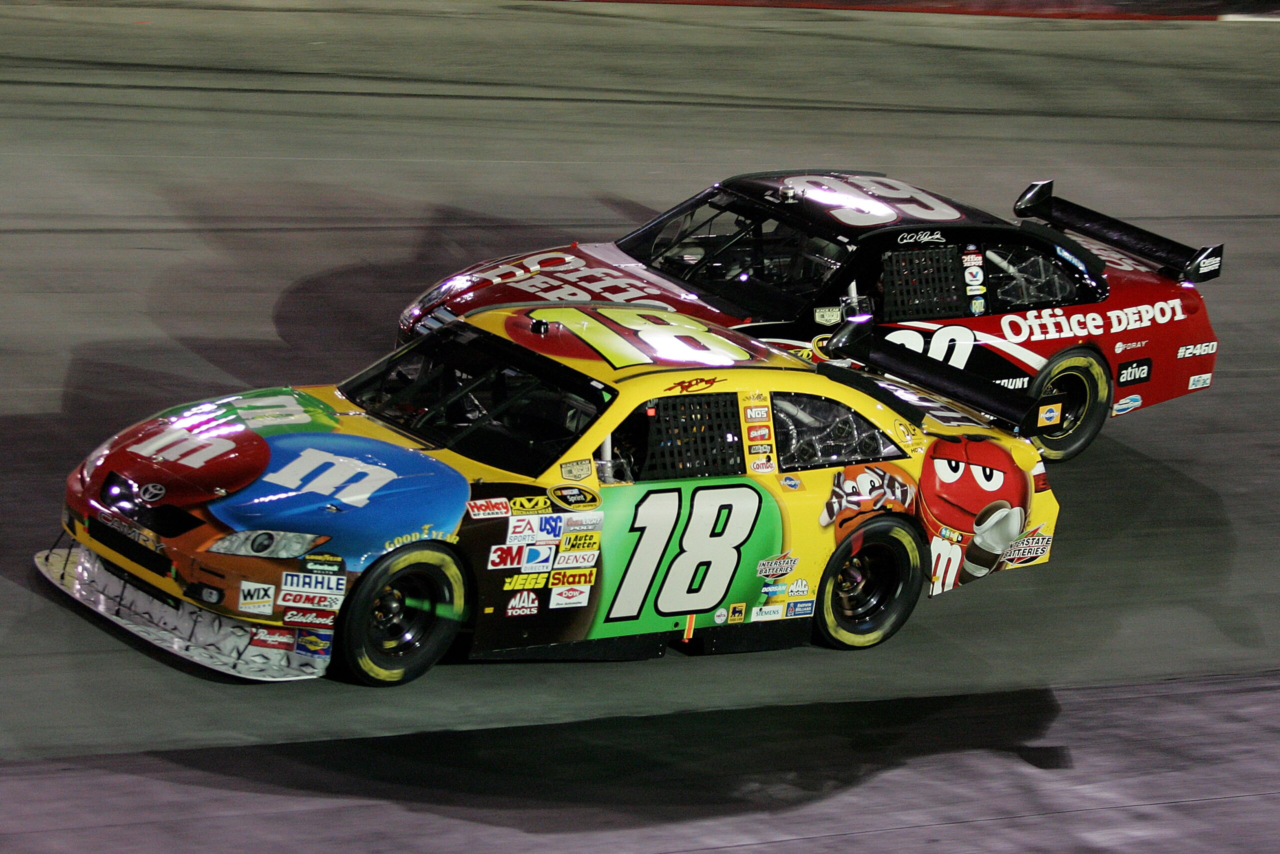 BRISTOL, TN - AUGUST 23: Klyle Busch driver of the #18 M&M's Toyota races with Carl Edwards driver of the #99 Office Depot Ford during the NASCAR Sprint Cup Series Sharpie 500 at Bristol Motor Speedway on August 23, 2008 in Bristol, Tennessee.  (Photo by 