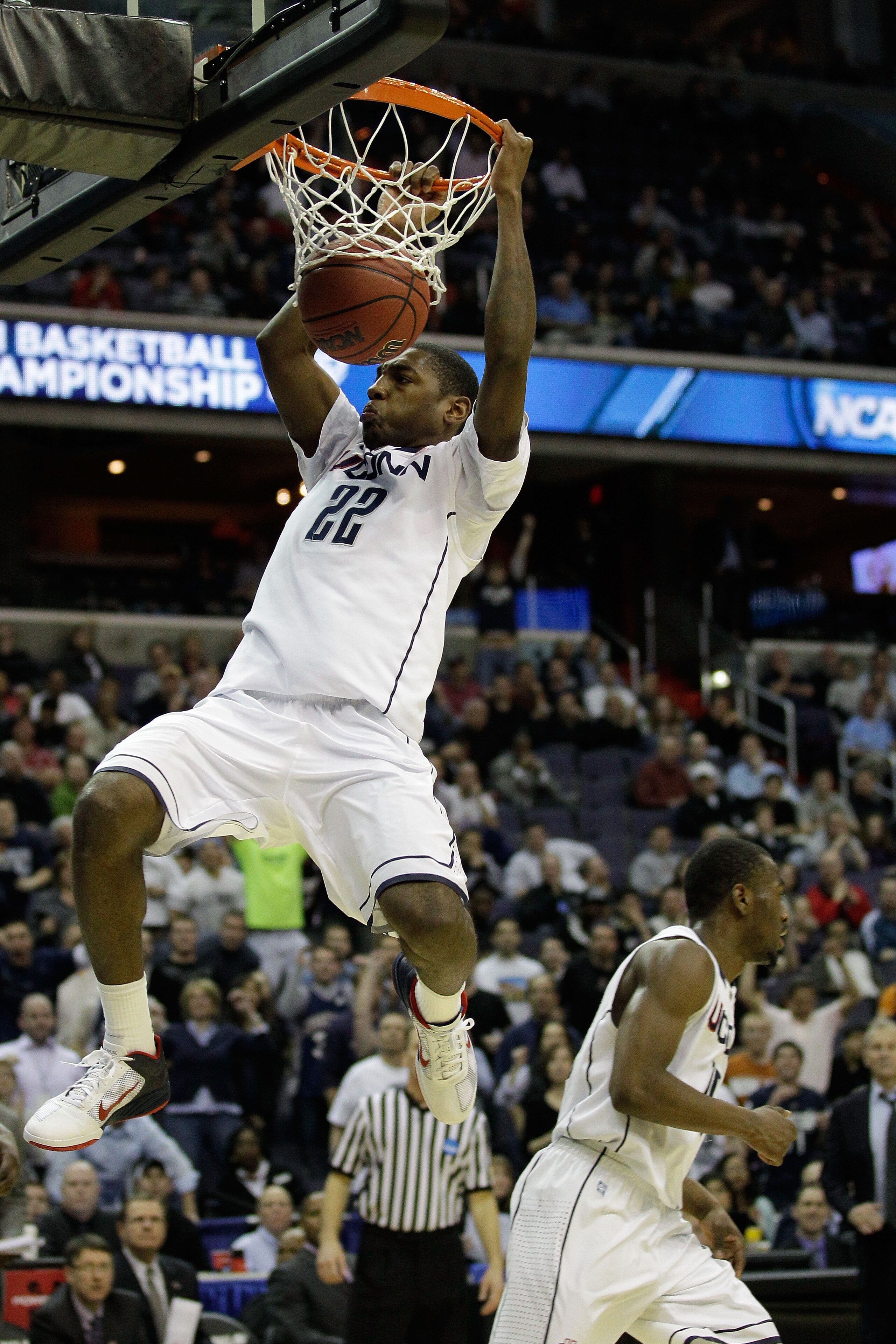 WASHINGTON - MARCH 19:  Roscoe Smith #22 of the Connecticut Huskies dunks against the Cincinnati Bearcats during the third round of the 2011 NCAA men's basketball tournament at Verizon Center on March 19, 2011 in Washington, DC.  (Photo by Rob Carr/Getty