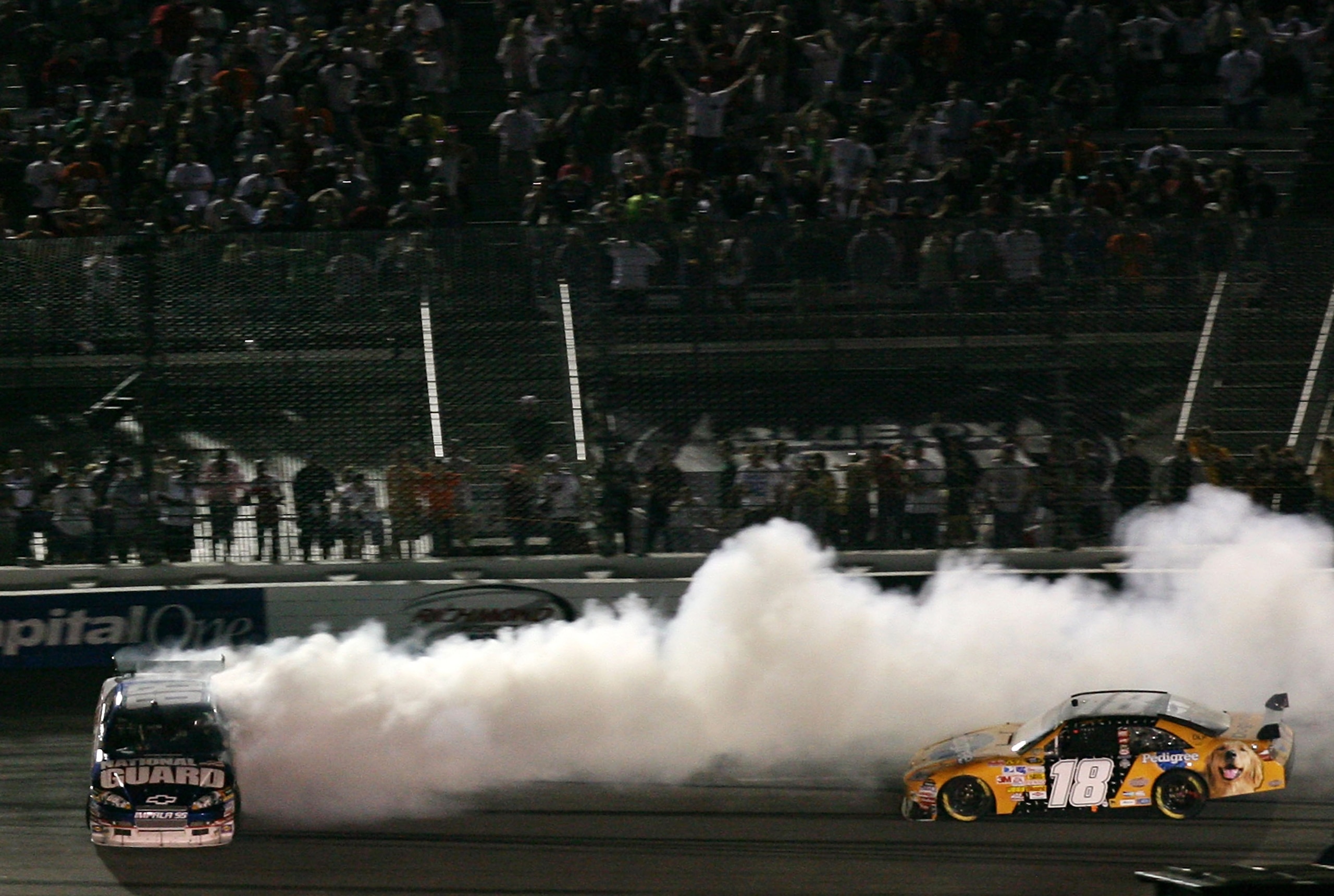 RICHMOND, VA - MAY 03: Dale Earnhardt Jr., driver of the #88 AMP Energy/National Guard Chevrolet, spins out of control after colliding with Kyle Busch, driver of the #18 Pedigree Toyota, during the NASCAR Sprint Cup Series Crown Royal Presents the Dan Low