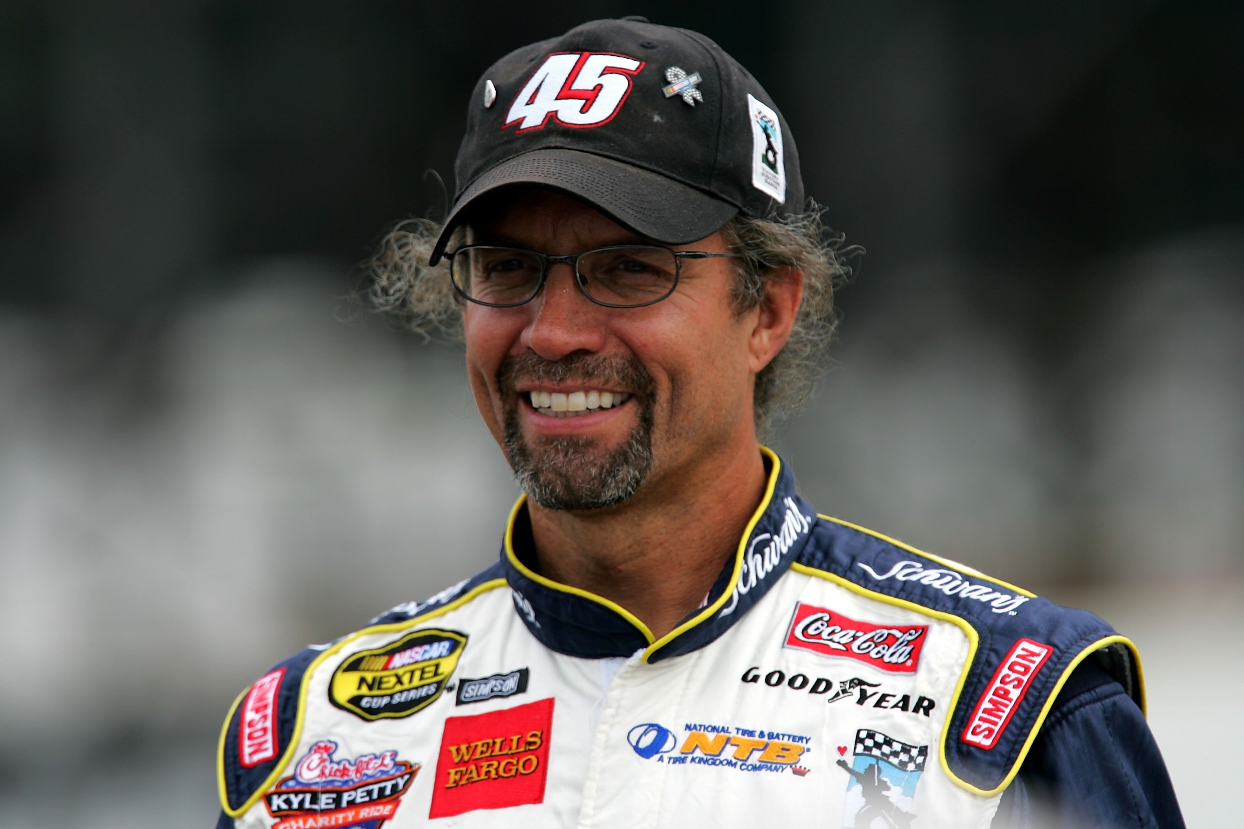 LONG POND, PA - JULY 21:  Kyle Petty, driver of the #45 Kyle Petty Charity Ride Dodge, looks on during qualifying for the NASCAR Nextel Cup Series Pennsylvania 500 on July 21, 2006 at Pocono Raceway in Long Pond, Pennsylvania.  (Photo by Chris Trotman/Get