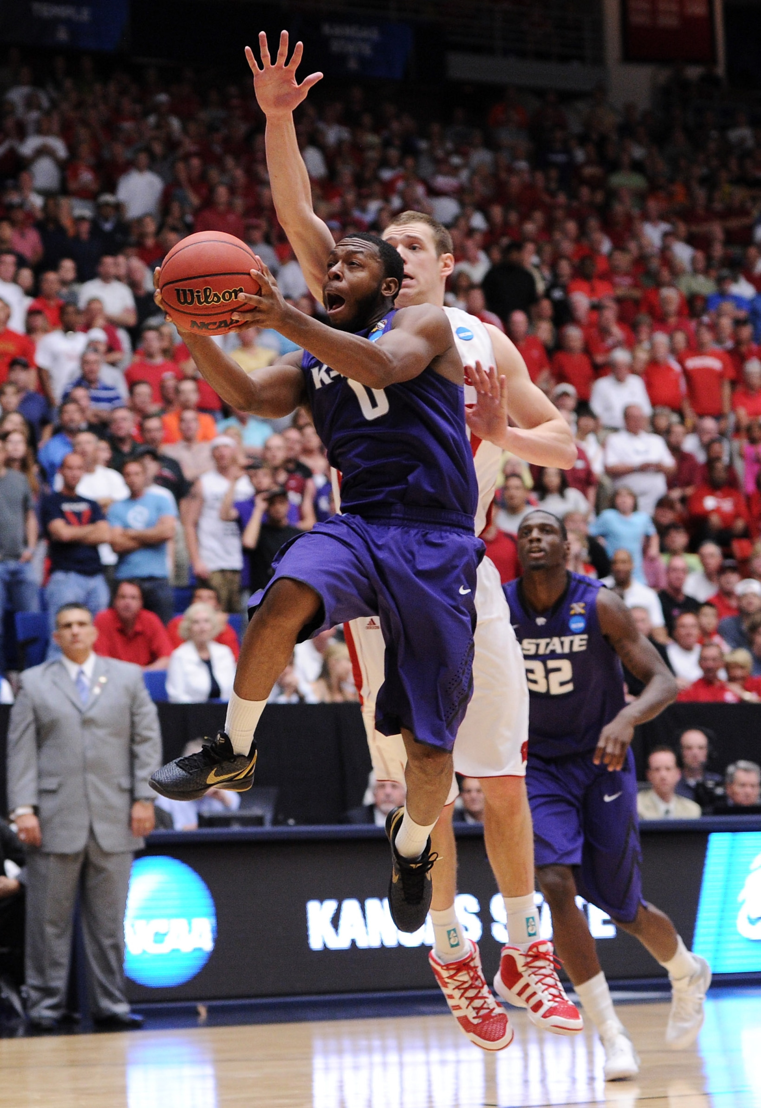 TUCSON, AZ - MARCH 19:  Jacob Pullen #0 of the Kansas State Wildcats shoots against Jon Leuer #30 of the Wisconsin Badgers during the third round of the 2011 NCAA men's basketball tournament at McKale Center on March 19, 2011 in Tucson, Arizona.  (Photo b