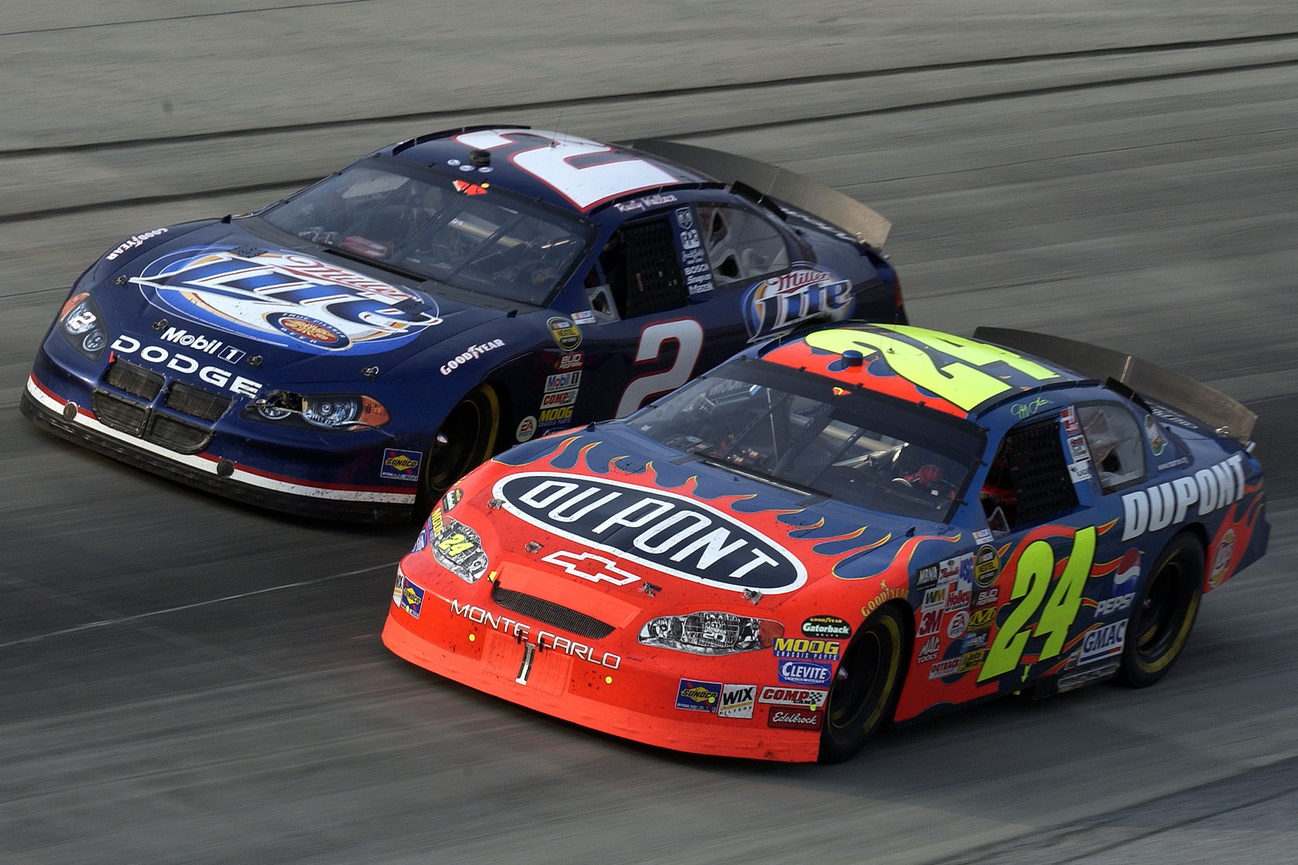 DOVER, DE - SEPTEMBER 26:  Jeff Gordon,  driver of the #24 Dupont Chevrolet, and Rusty Wallace, driver of the #2 Penske Racing Dodge, race during the NASCAR Nextel Cup Series MBNA America 400 on September 26, 2004 at Dover International Speedway in Dover,