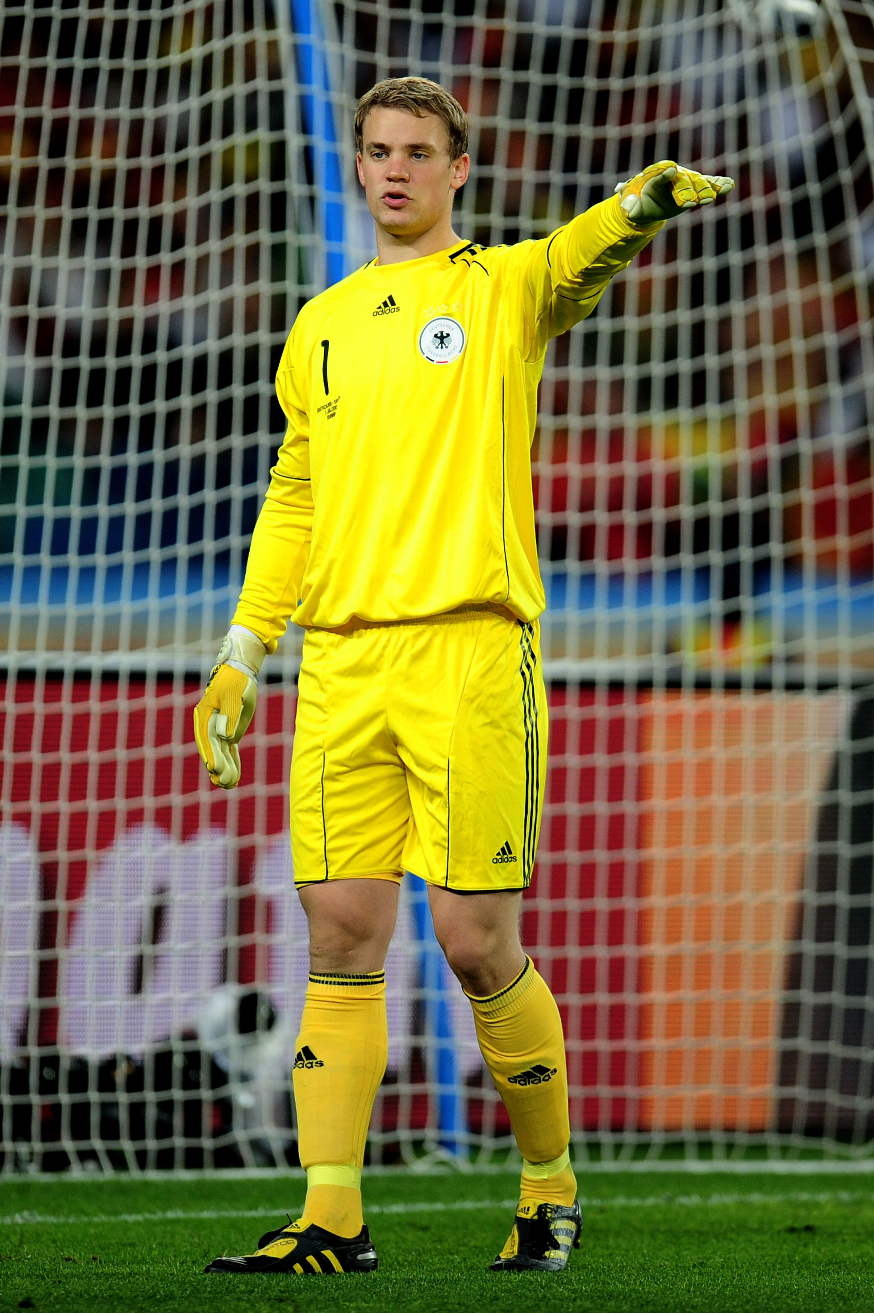 DURBAN, SOUTH AFRICA - JULY 07:  Manuel Neuer of Germany directs his defence during the 2010 FIFA World Cup South Africa Semi Final match between Germany and Spain at Durban Stadium on July 7, 2010 in Durban, South Africa.  (Photo by Clive Mason/Getty Ima
