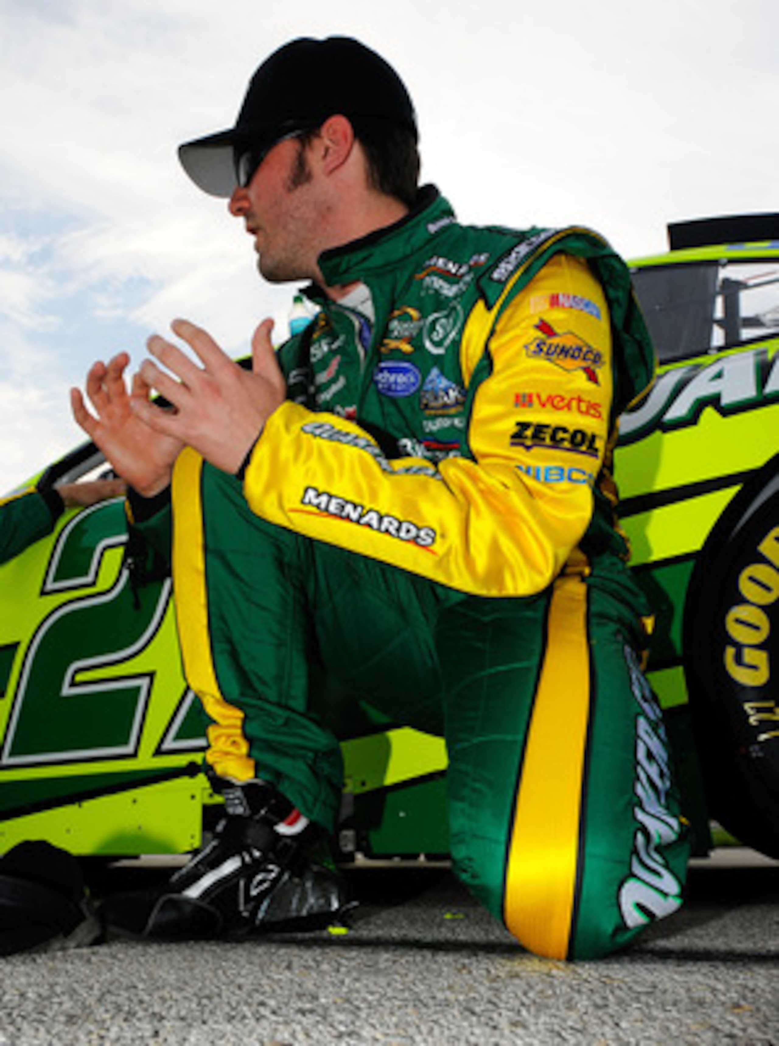 FORT WORTH, TX - APRIL 09:  Paul Menard, driver of the #27 Quaker State/Menards Chevrolet, kneels on the grid prior to the start of the NASCAR Sprint Cup Series Samsung Mobile 500 at Texas Motor Speedway on April 9, 2011 in Fort Worth, Texas.  (Photo by J
